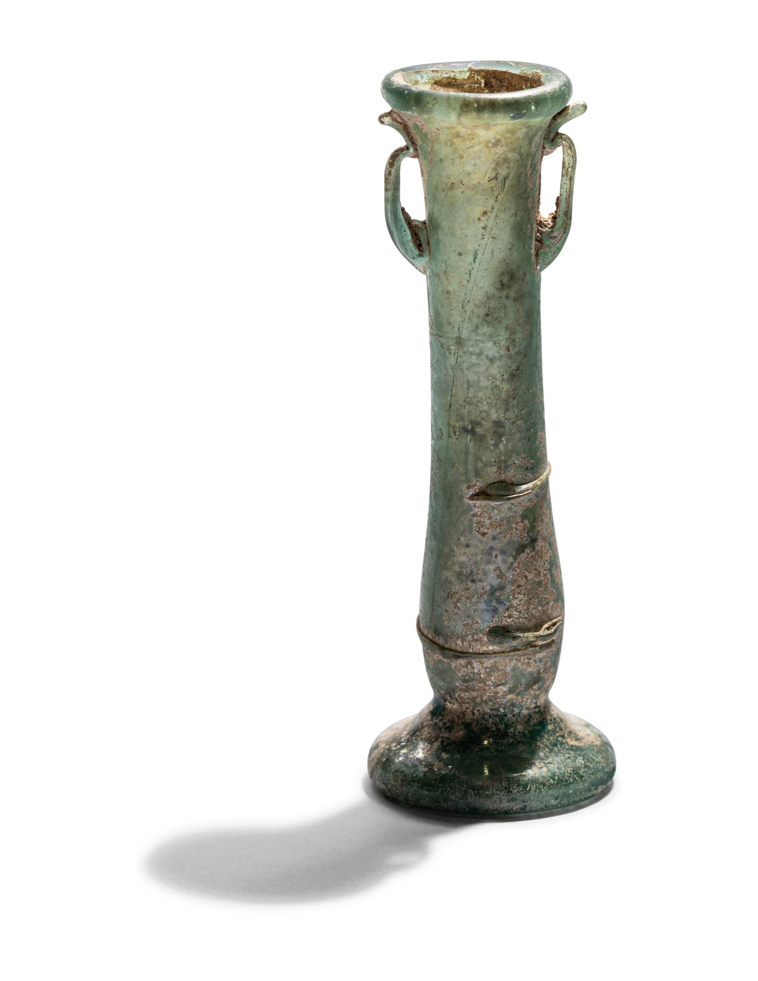 A Roman Blue Glass Unguentarium