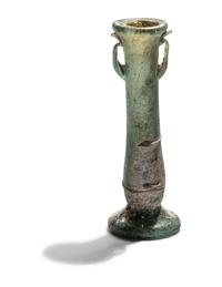 A Roman Blue Glass Unguentarium
