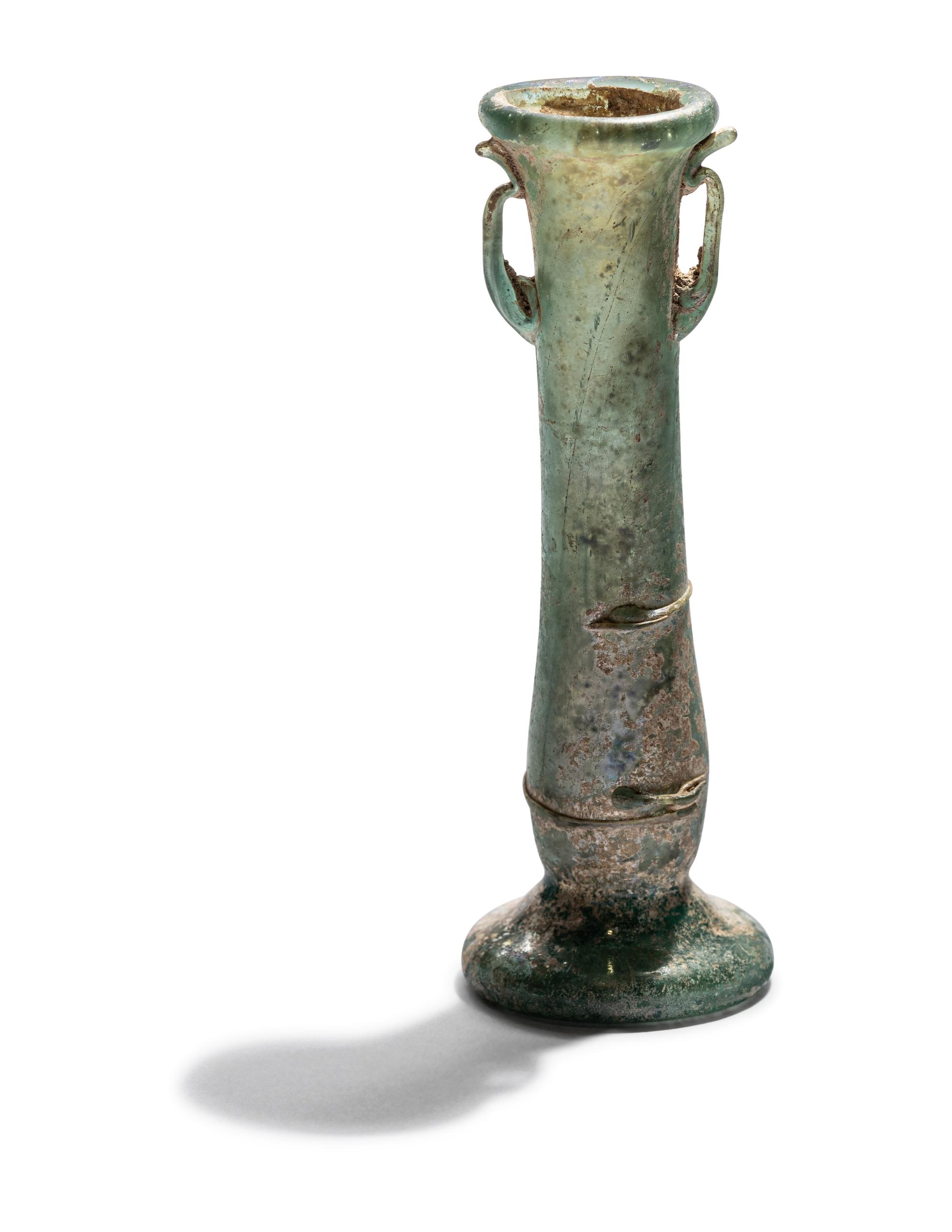 A Roman Blue Glass Unguentarium