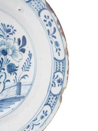 A Dutch Blue and White Glazed Delftware Charger