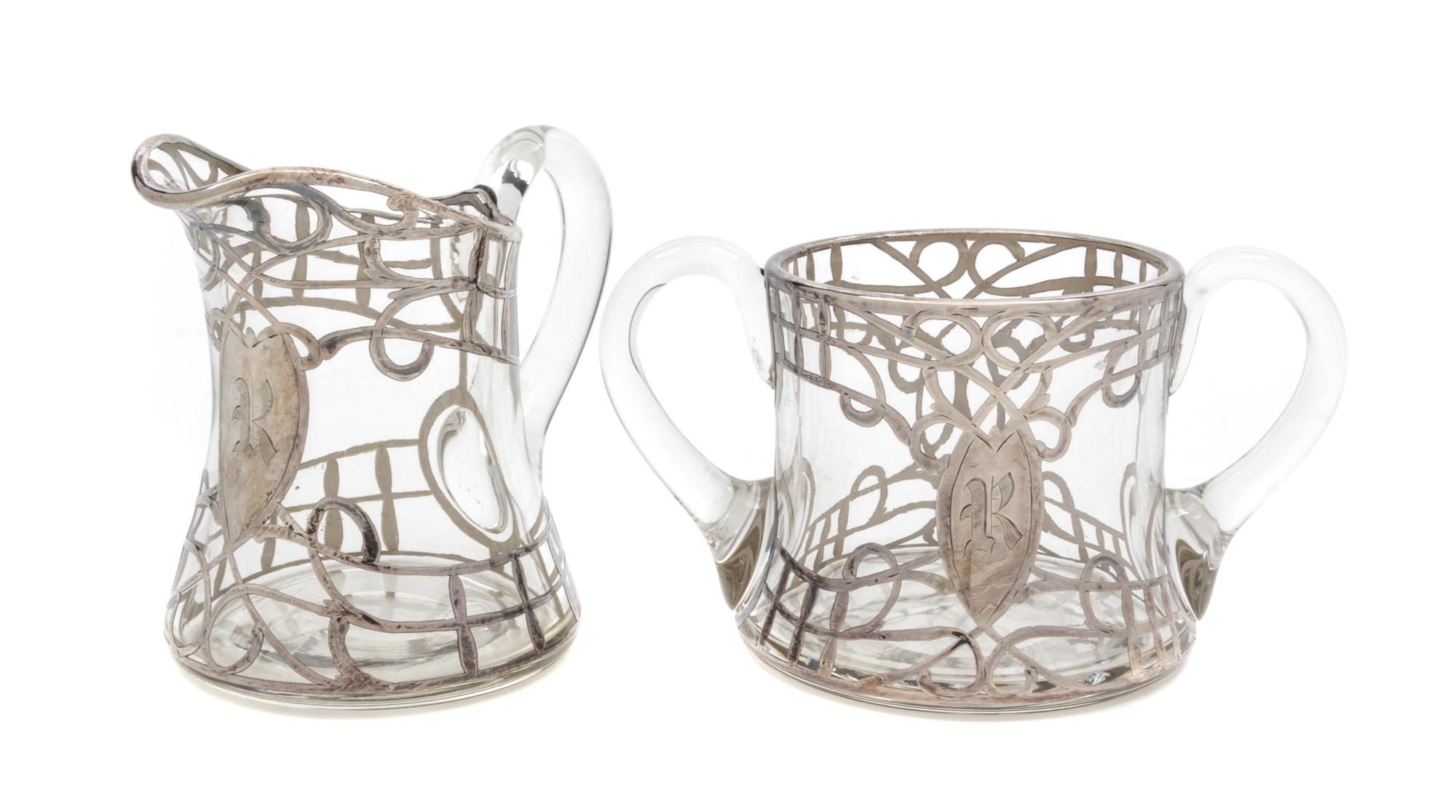 A Silver Overlay Glass Creamer and Sugar Set Height of creamer 4 1/8 inches.