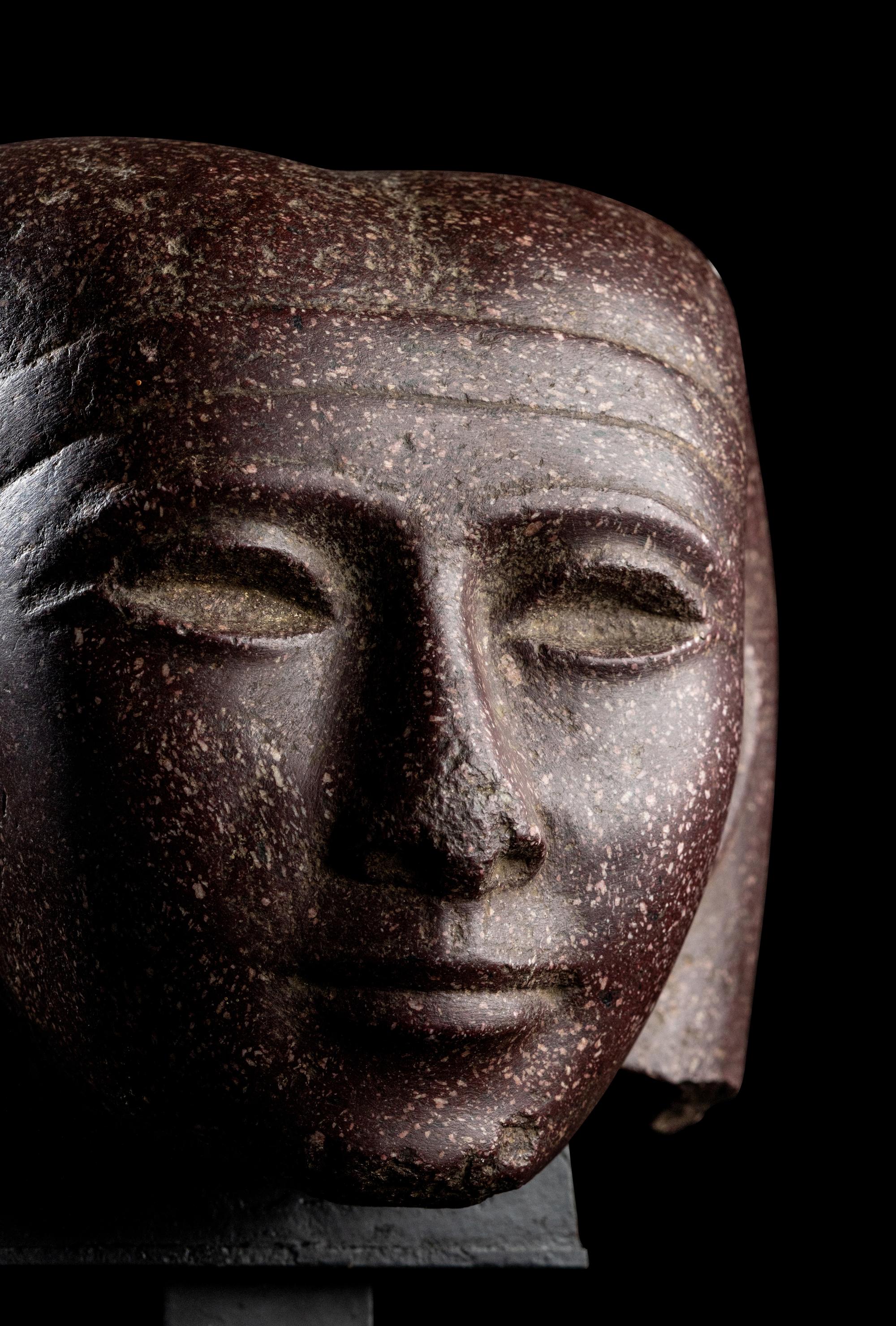 A Roman Porphyry Head of an Egyptian Woman