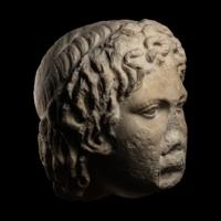 A Roman Marble Head of a Satyr