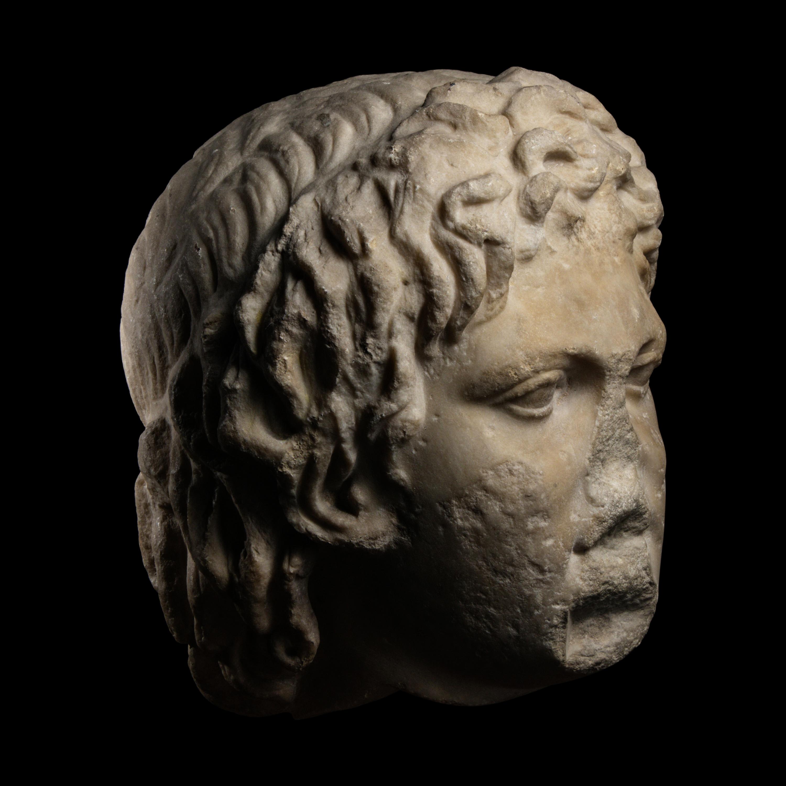 A Roman Marble Head of a Satyr