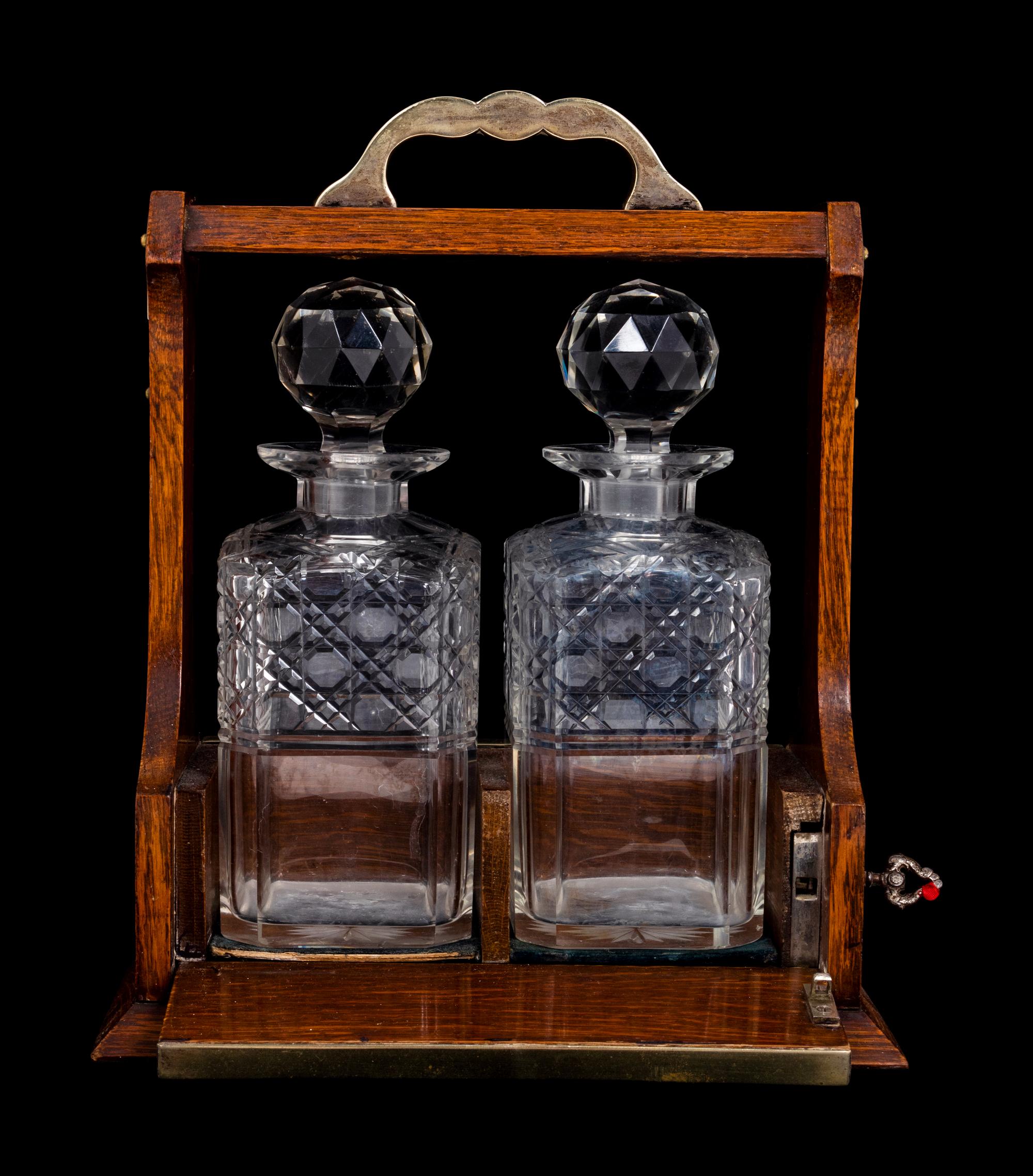 A Scottish Silver-Plate, Oak and Cut Glass Tantalus