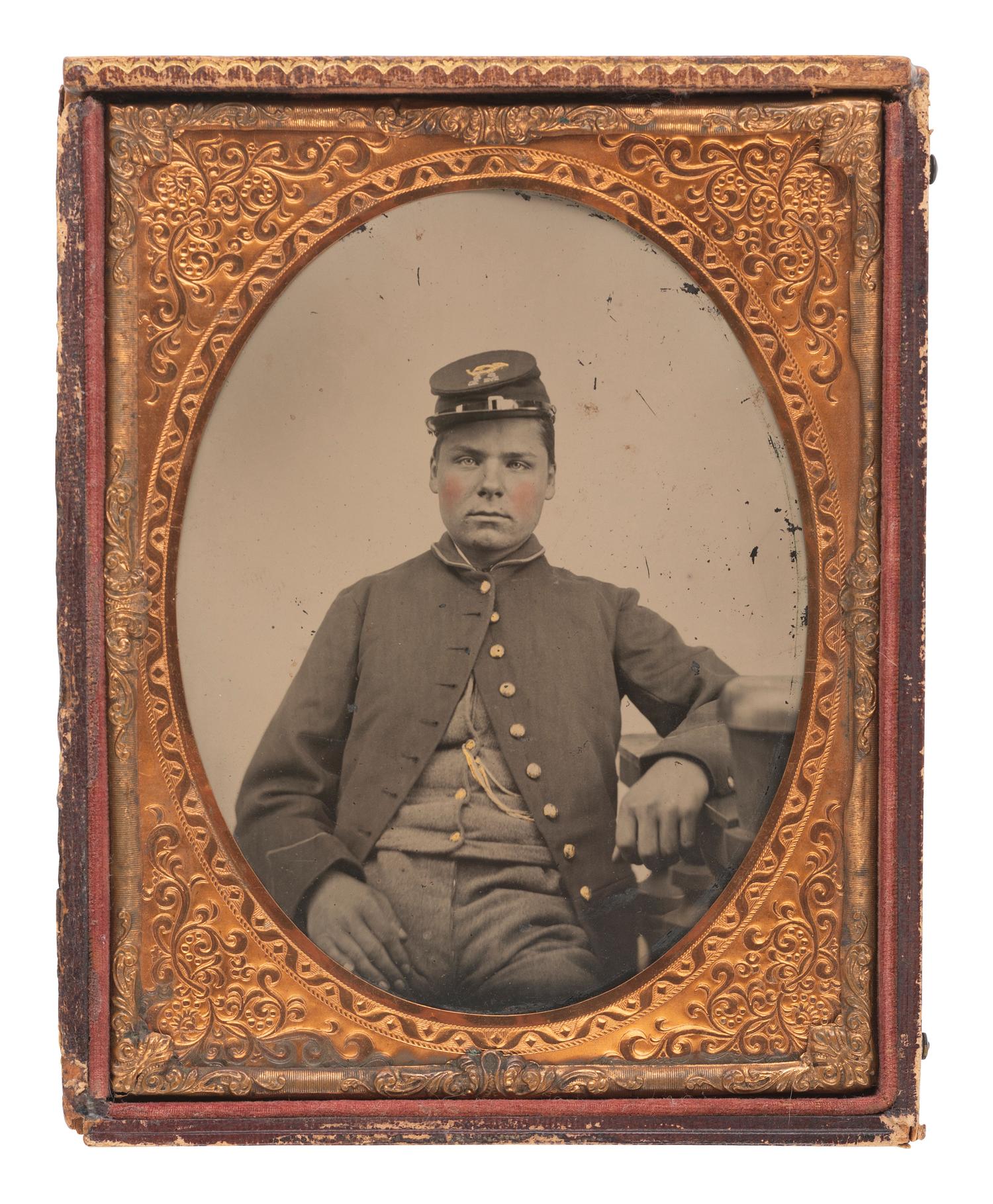 [CIVIL WAR]. Half plate tintype of a soldier wearing frock coat and forage cap.