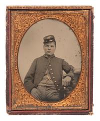 [CIVIL WAR]. Half plate tintype of a soldier wearing frock coat and forage cap.