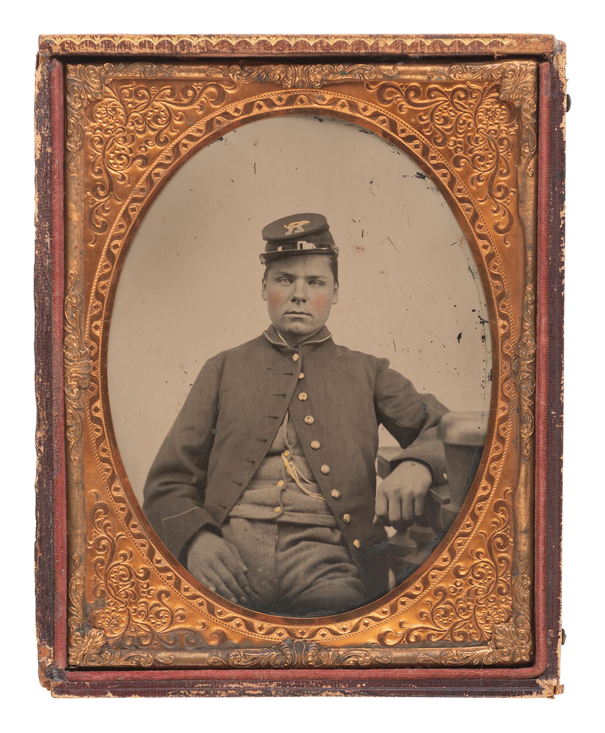 [CIVIL WAR]. Half plate tintype of a soldier wearing frock coat and forage cap.