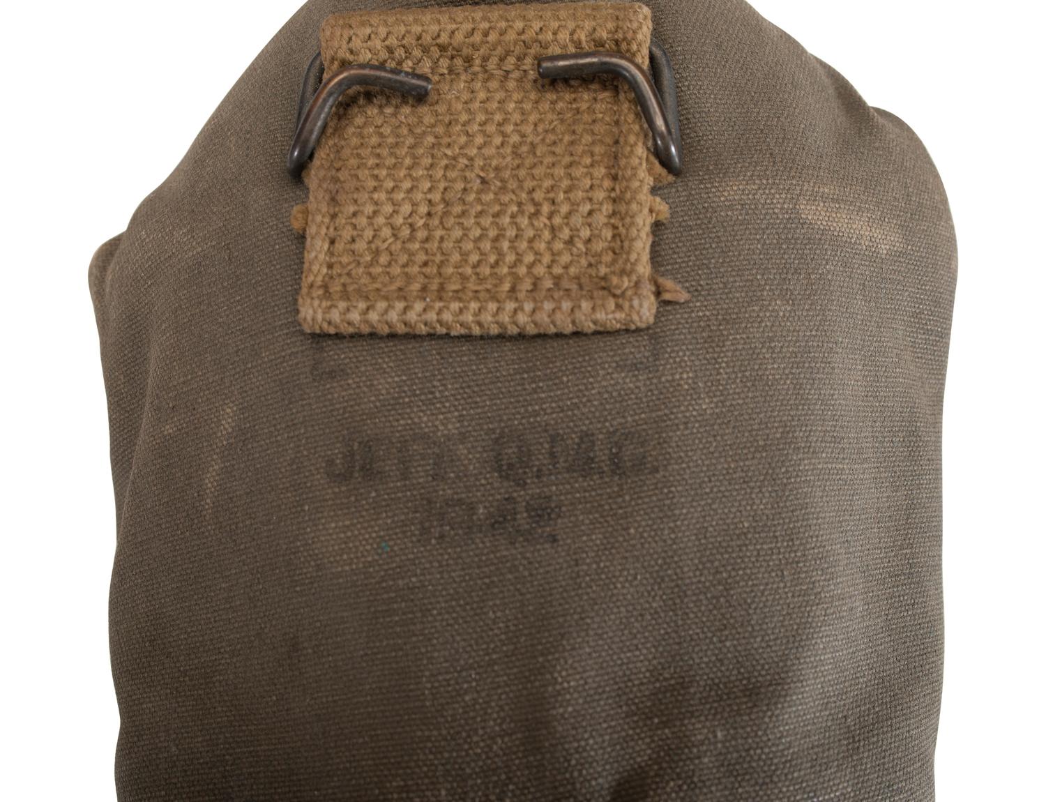 [MILITARIA]. World War II and Korean War-era canteens, canteen covers, and mess kits.