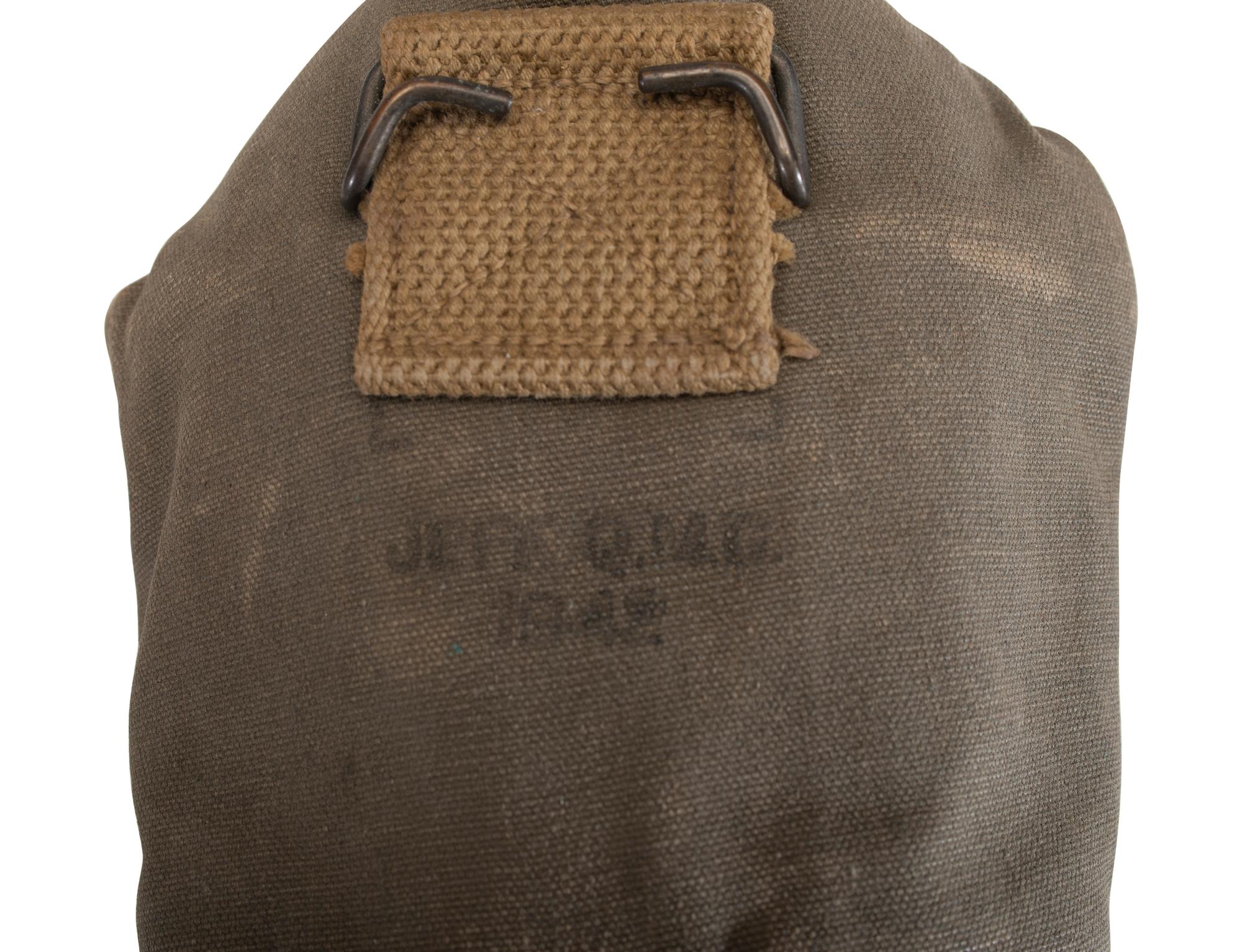 [MILITARIA]. World War II and Korean War-era canteens, canteen covers, and mess kits.