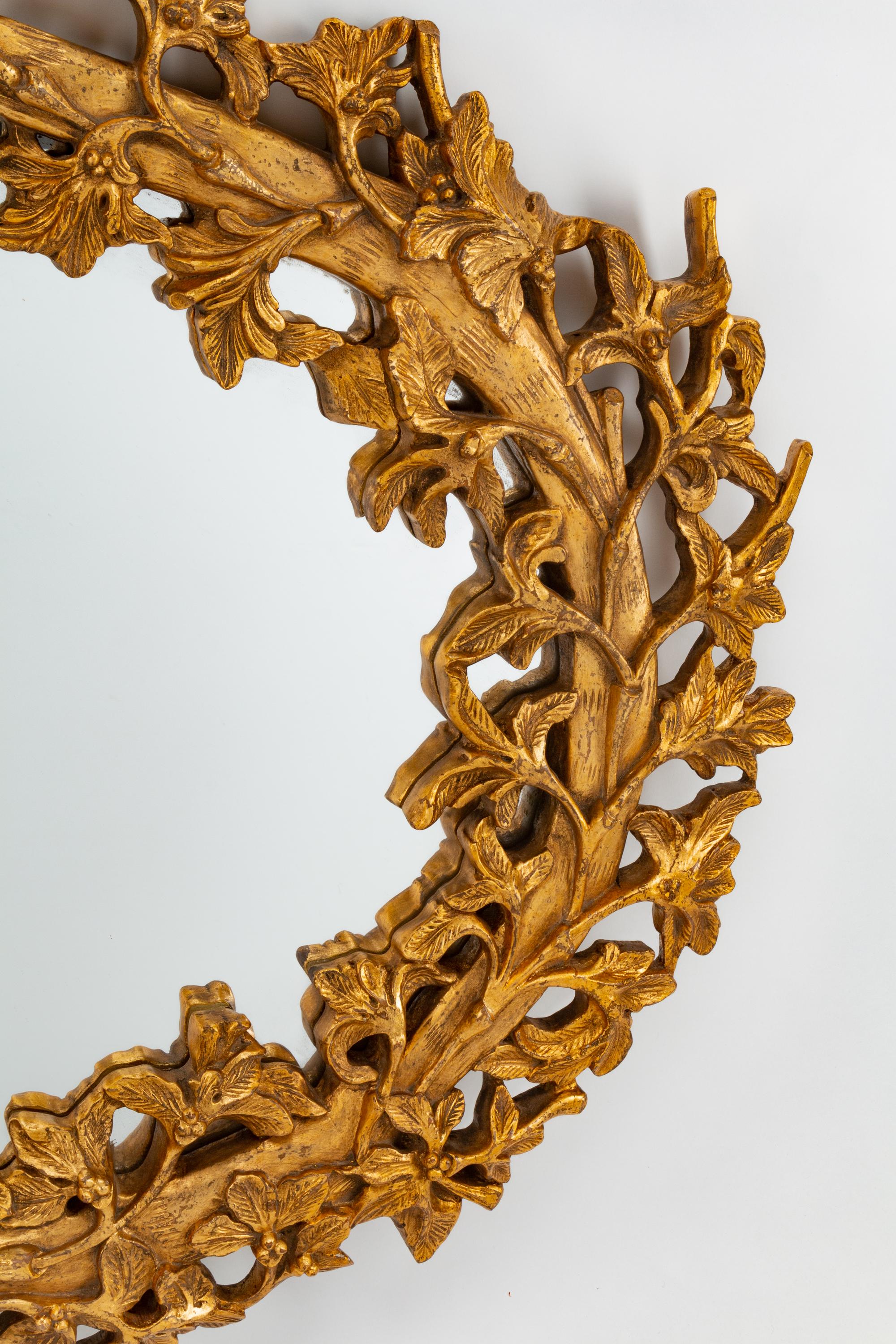 An Italian Rococo Style Carved Giltwood Oval Mirror