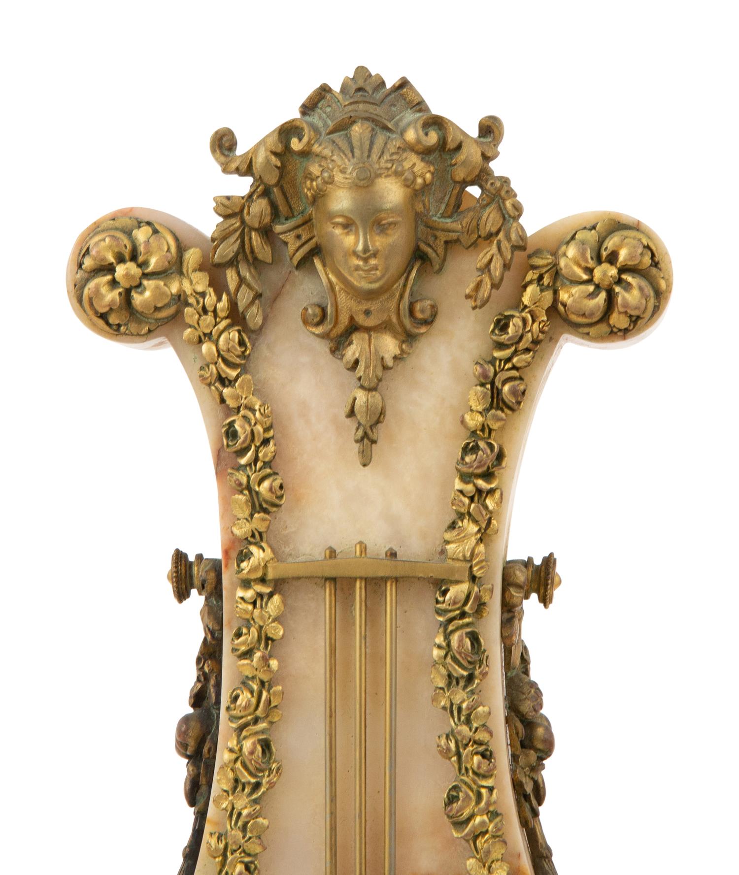 A French Gilt Bronze Mounted Onyx Clock Garniture
