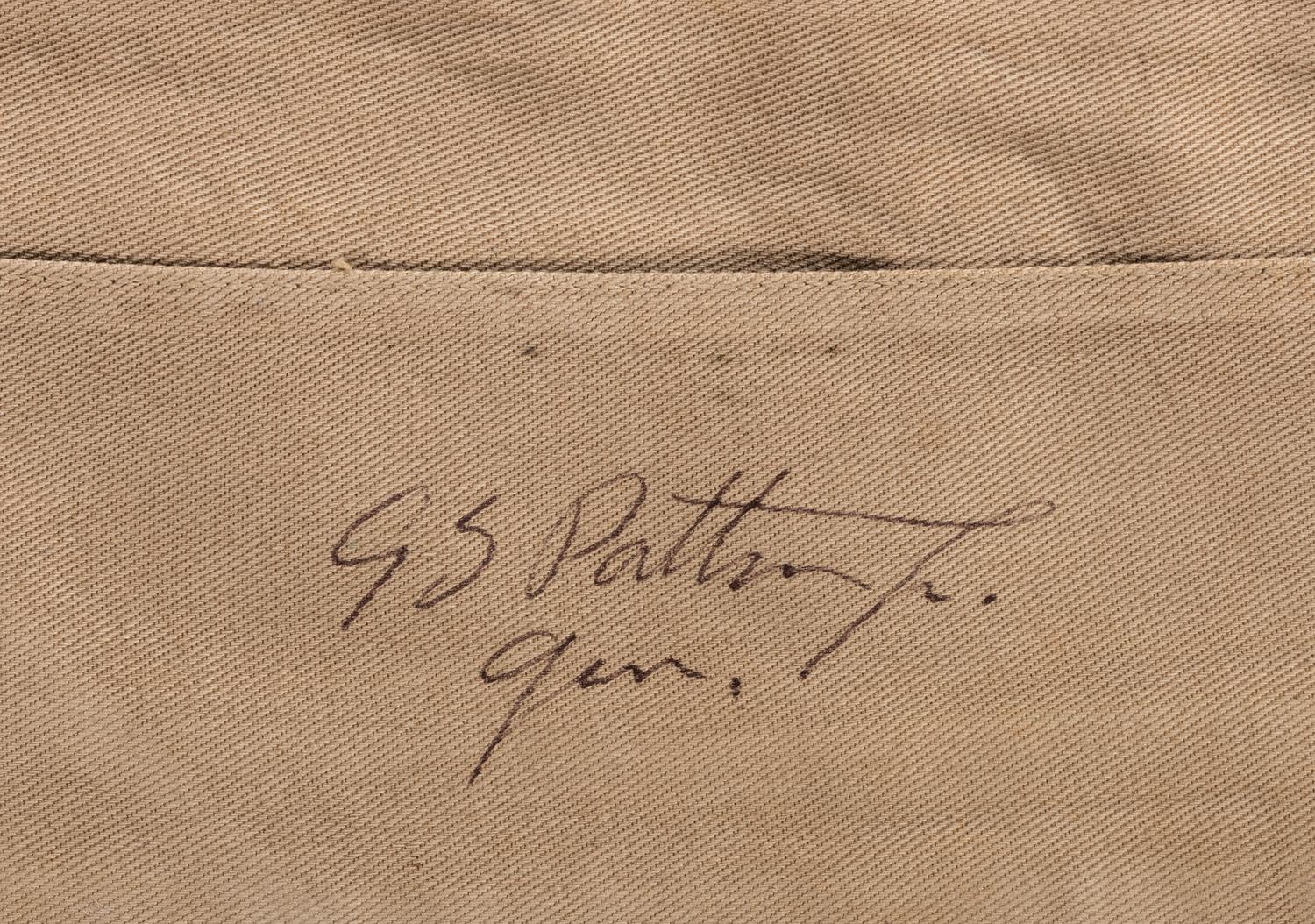 [WORLD WAR II]. PATTON, George S. (1885-1945). Garrison cap signed ("GS Patton Jr. Gen.") in presentation display.