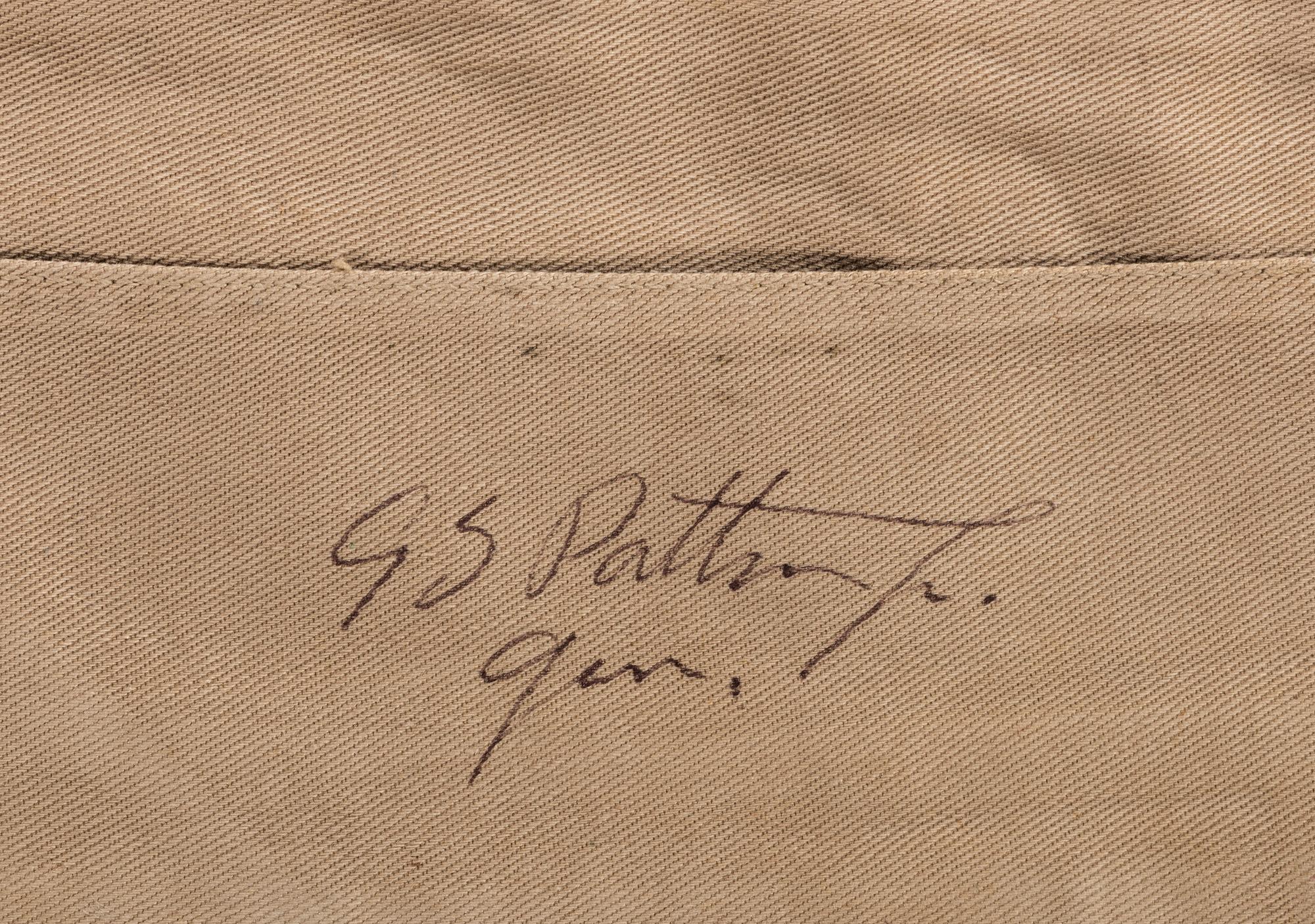 [WORLD WAR II]. PATTON, George S. (1885-1945). Garrison cap signed ("GS Patton Jr. Gen.") in presentation display.