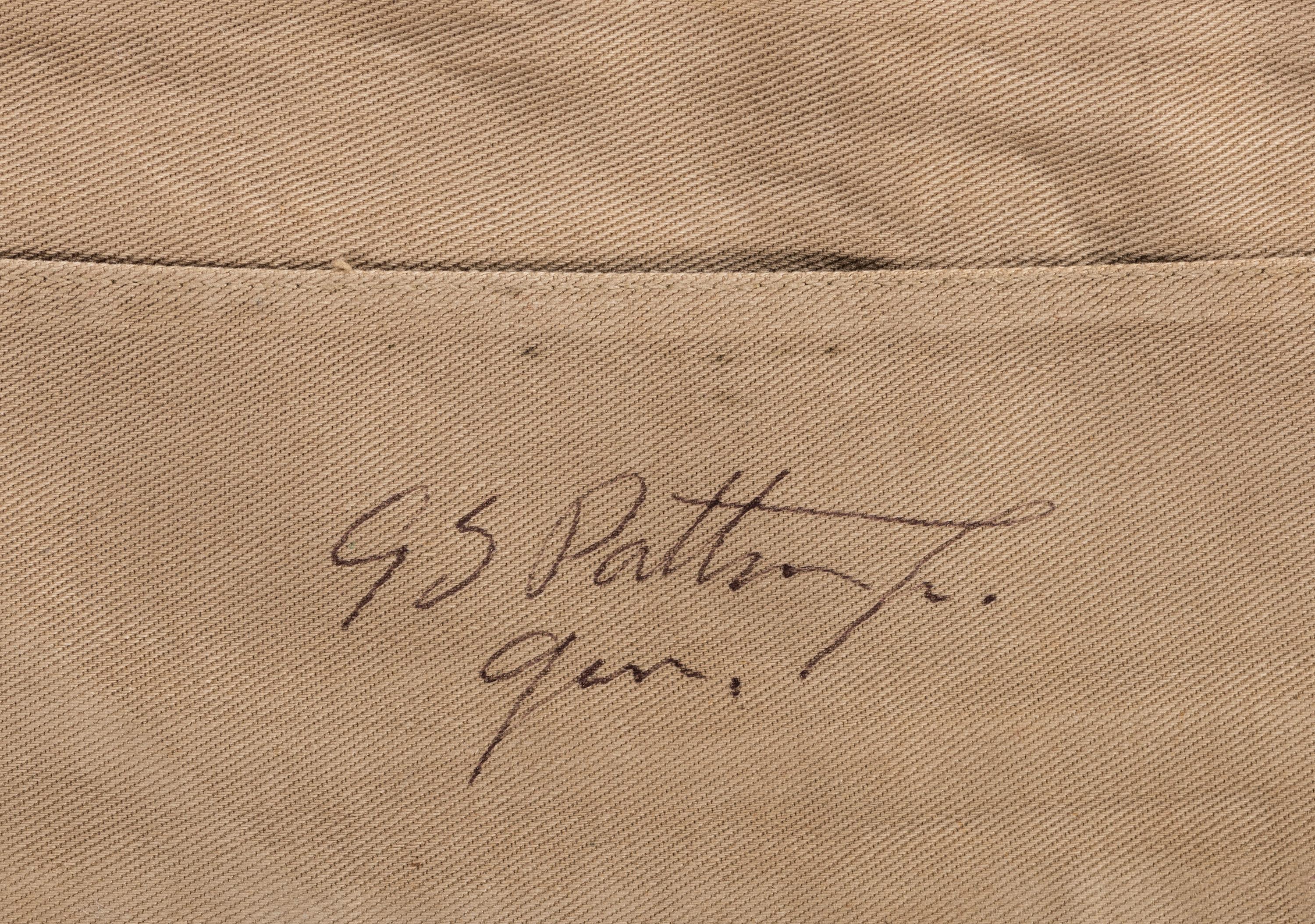 [WORLD WAR II]. PATTON, George S. (1885-1945). Garrison cap signed ("GS Patton Jr. Gen.") in presentation display.