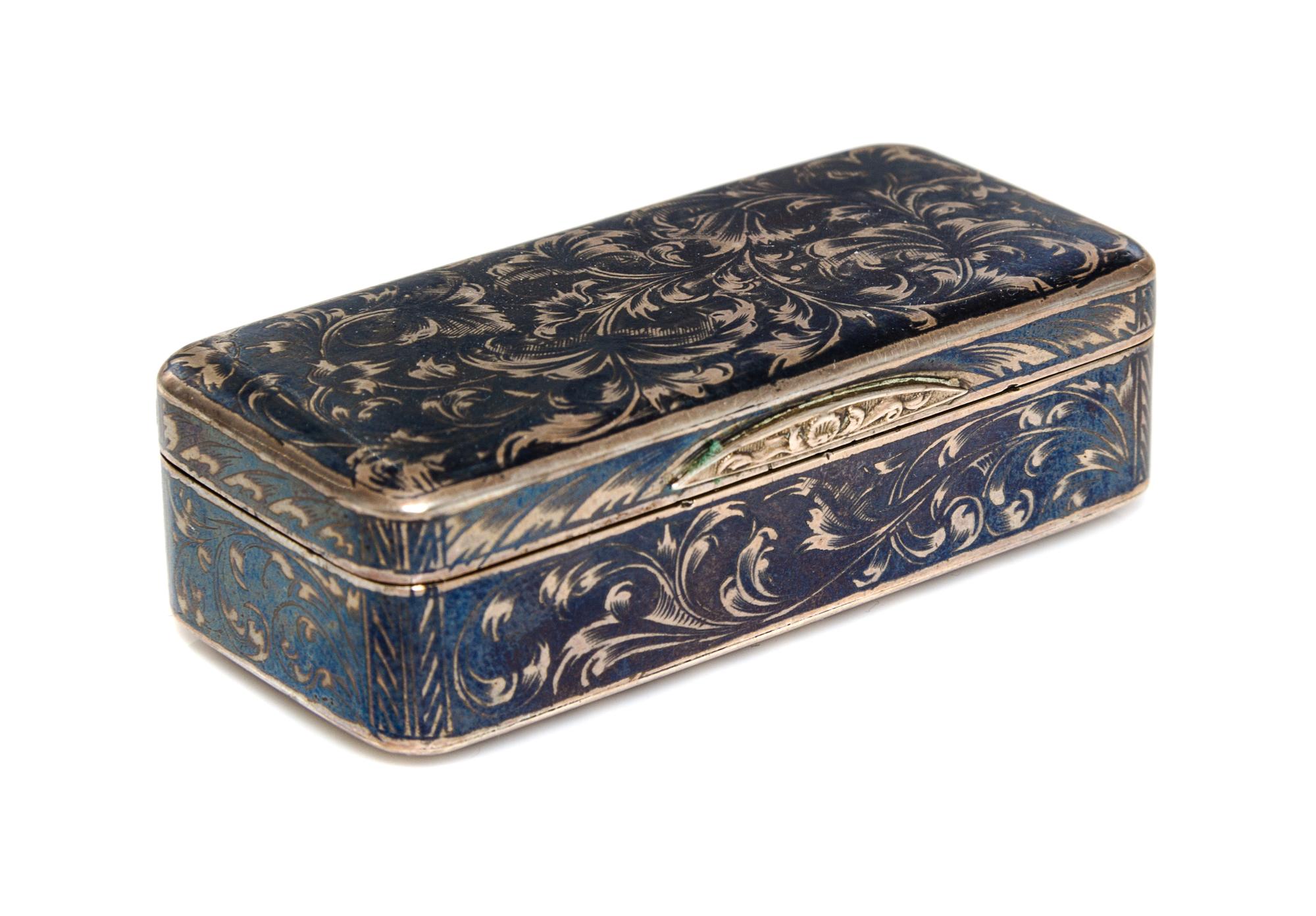 A Russian Niello Silver Snuff Box, Moscow, 19th Century, of rectangular form with floral scroll decoration.