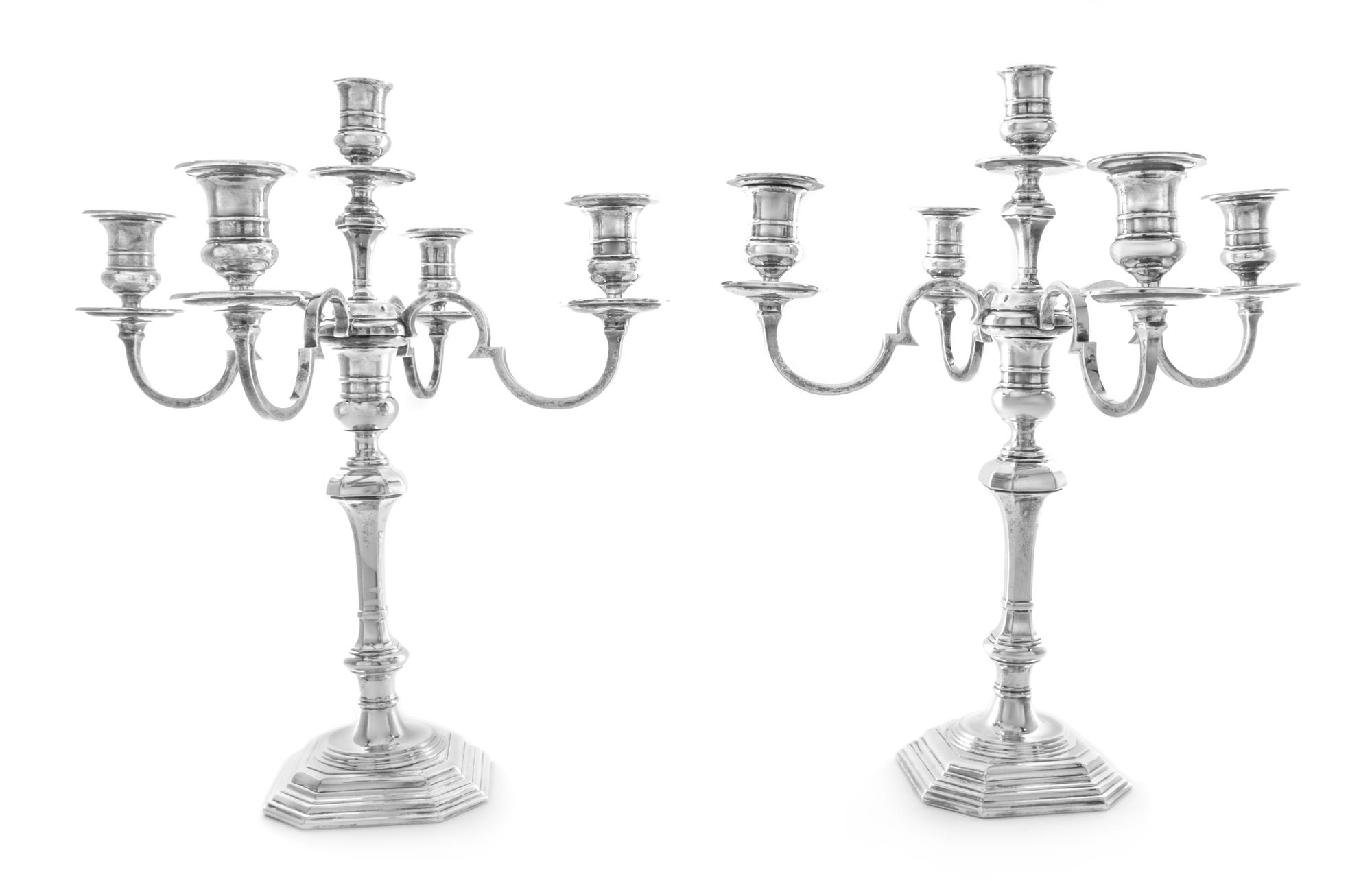 A Pair of George V Silver Five-Light Candelabra, Lionel Alfred Crichton, London, 1931, each having a central urn form candle cup issuin