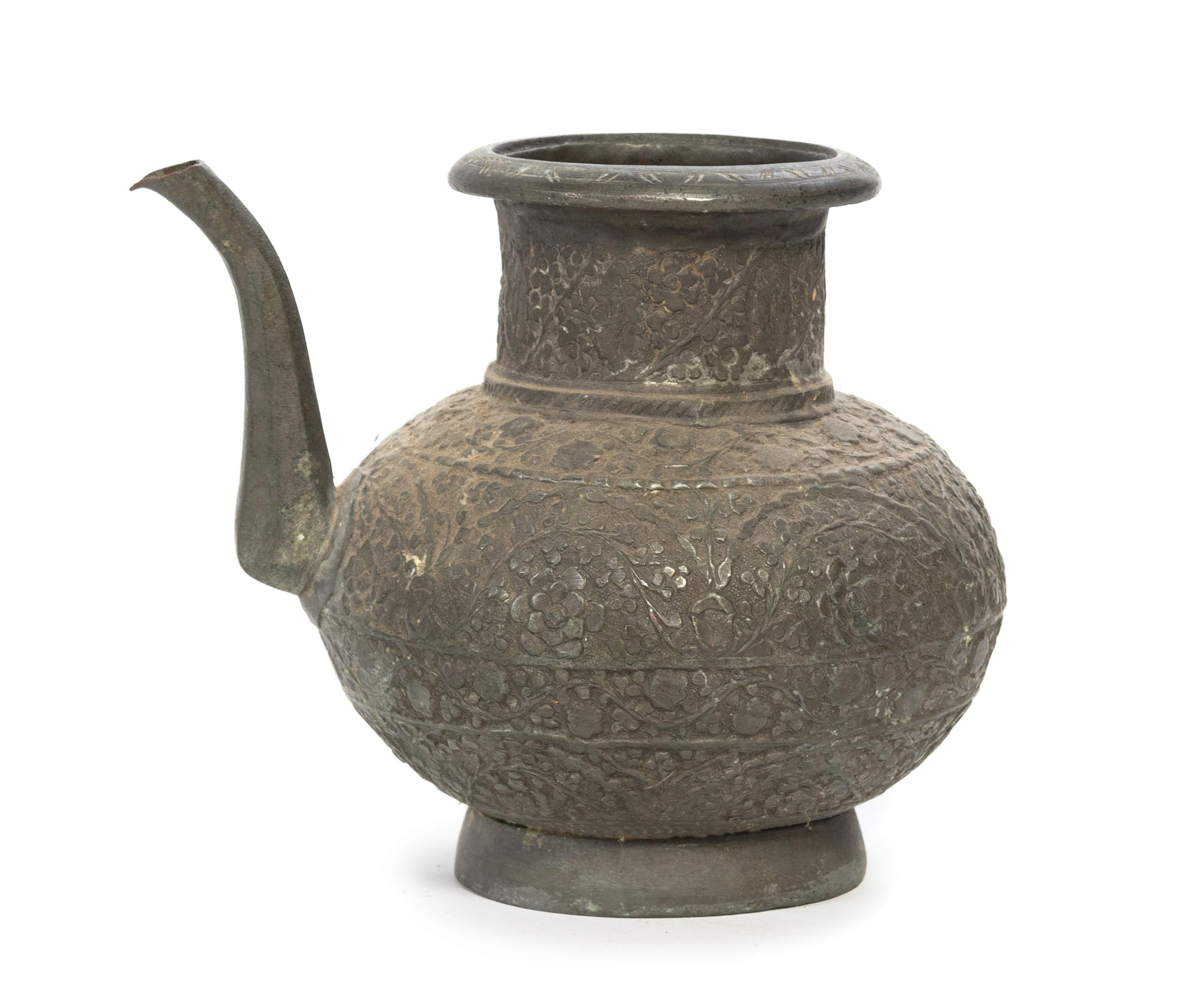 A Middle Eastern Pewter Ewer Height 8 1/2 inches.