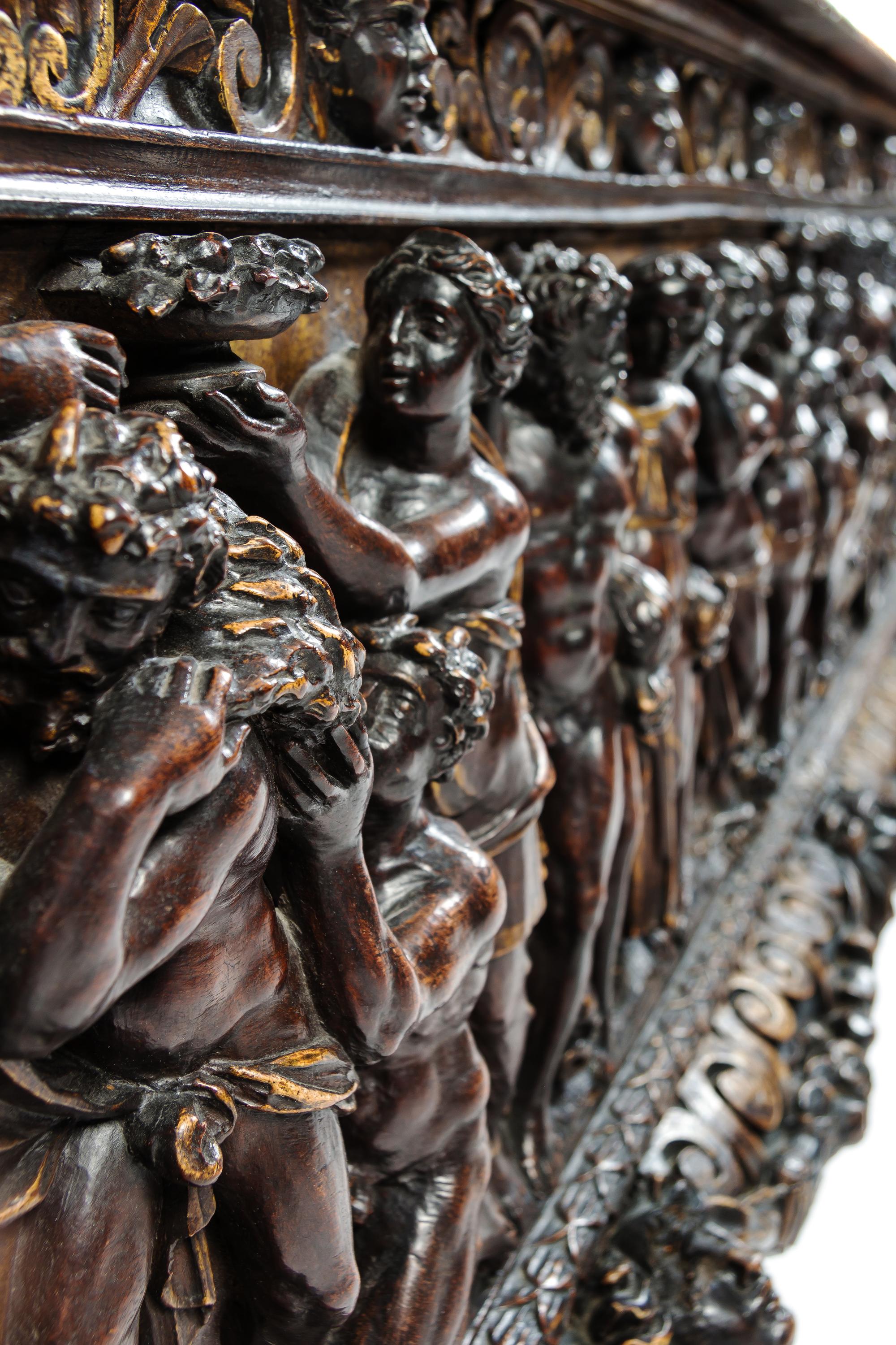 A Pair of Italian Renaissance Style Parcel Gilt Walnut Cassoni Height 32 x width 72 x depth 25 inches. — 19TH CENTURY WITH 17TH CENTURY ELEMENTS
