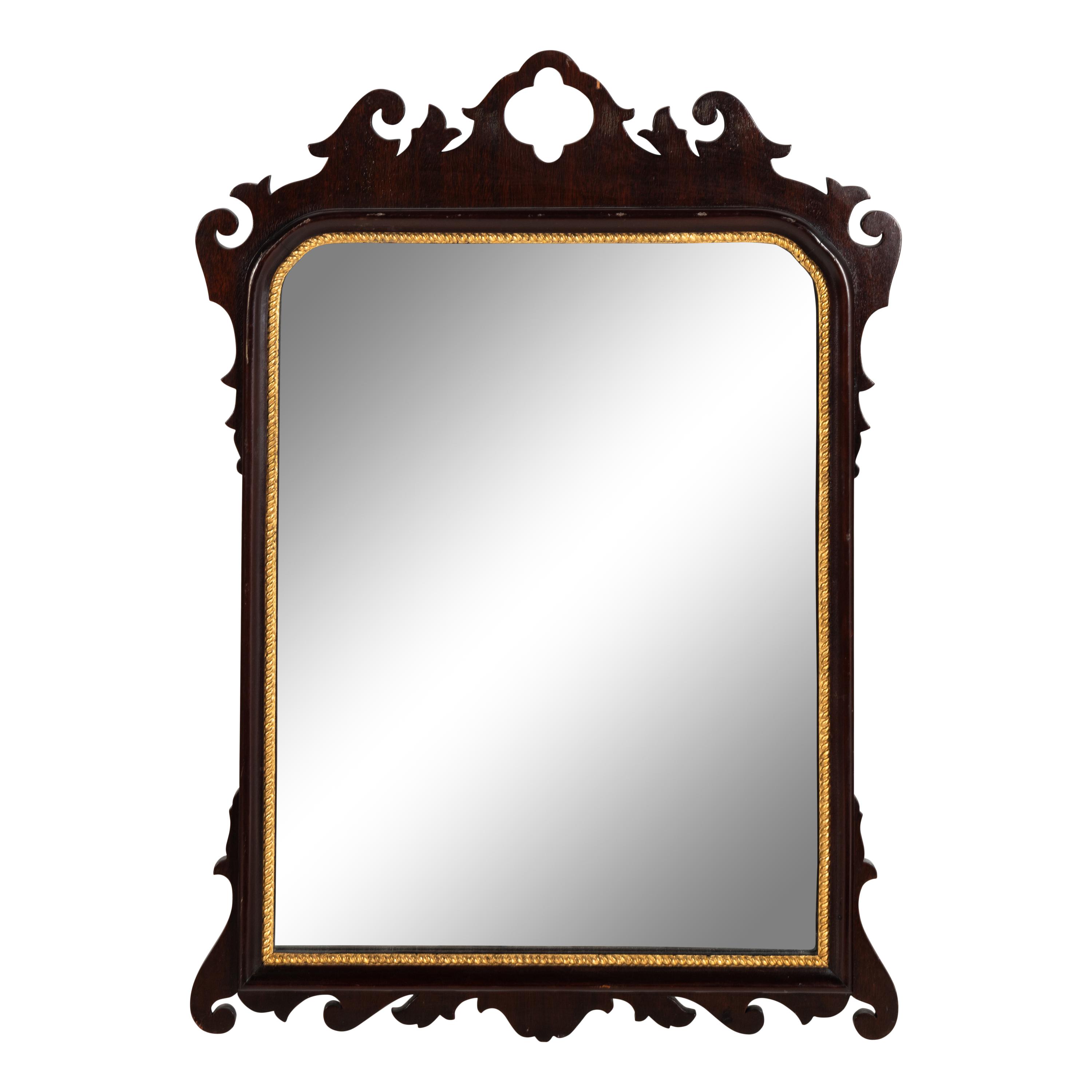 A George III Style Mahogany and Parcel Gilt Mirror