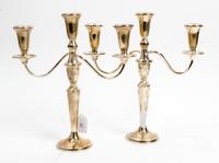 A Pair of American Silver Three-Light Candelabra, Retailed by Neiman Marcus, 20th Century, the baluster form stem issuing the central c