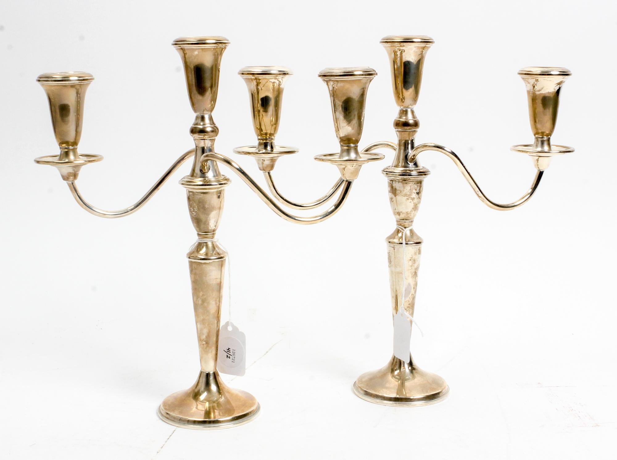 A Pair of American Silver Three-Light Candelabra, Retailed by Neiman Marcus, 20th Century, the baluster form stem issuing the central c