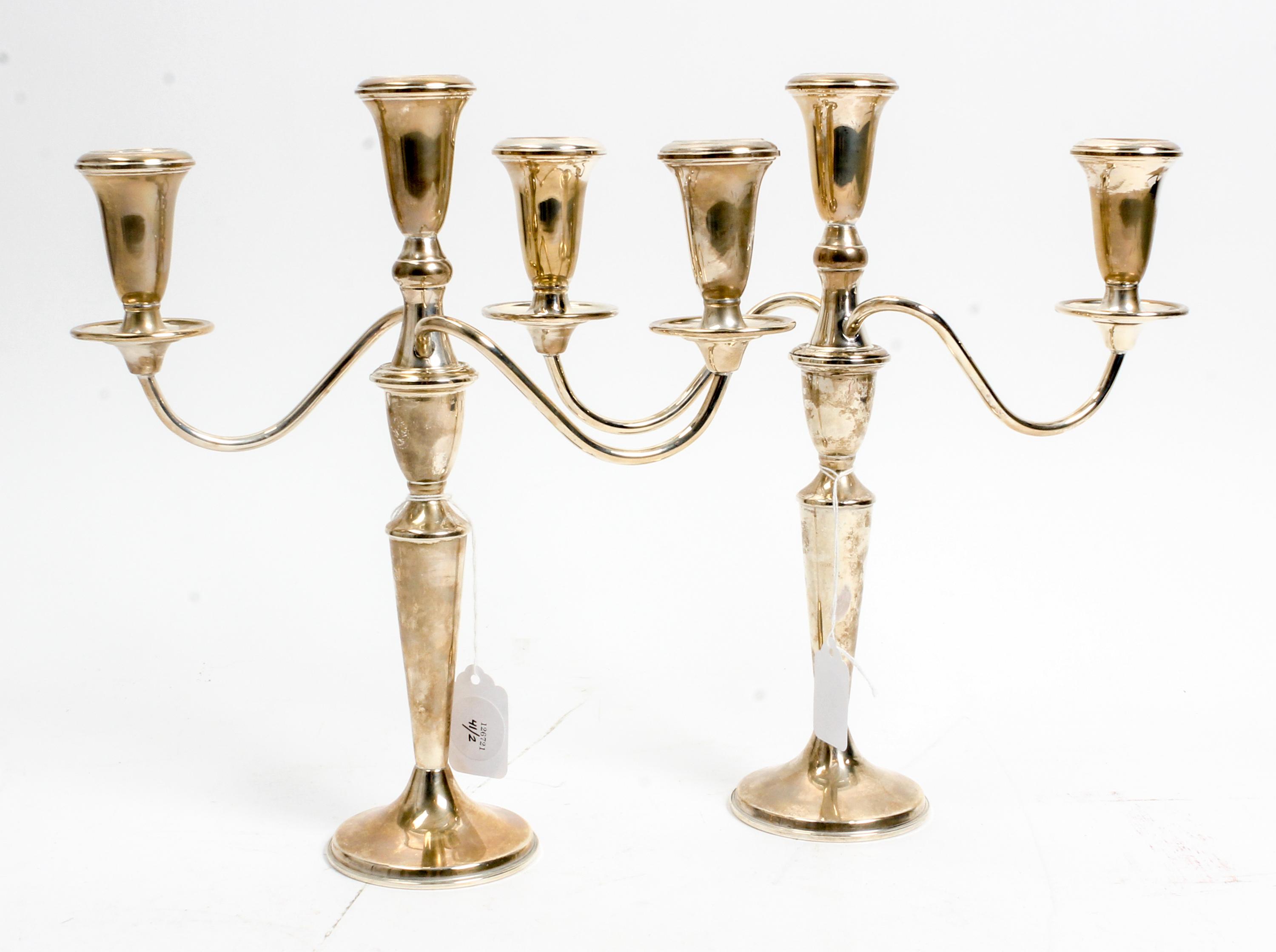 A Pair of American Silver Three-Light Candelabra, Retailed by Neiman Marcus, 20th Century, the baluster form stem issuing the central c