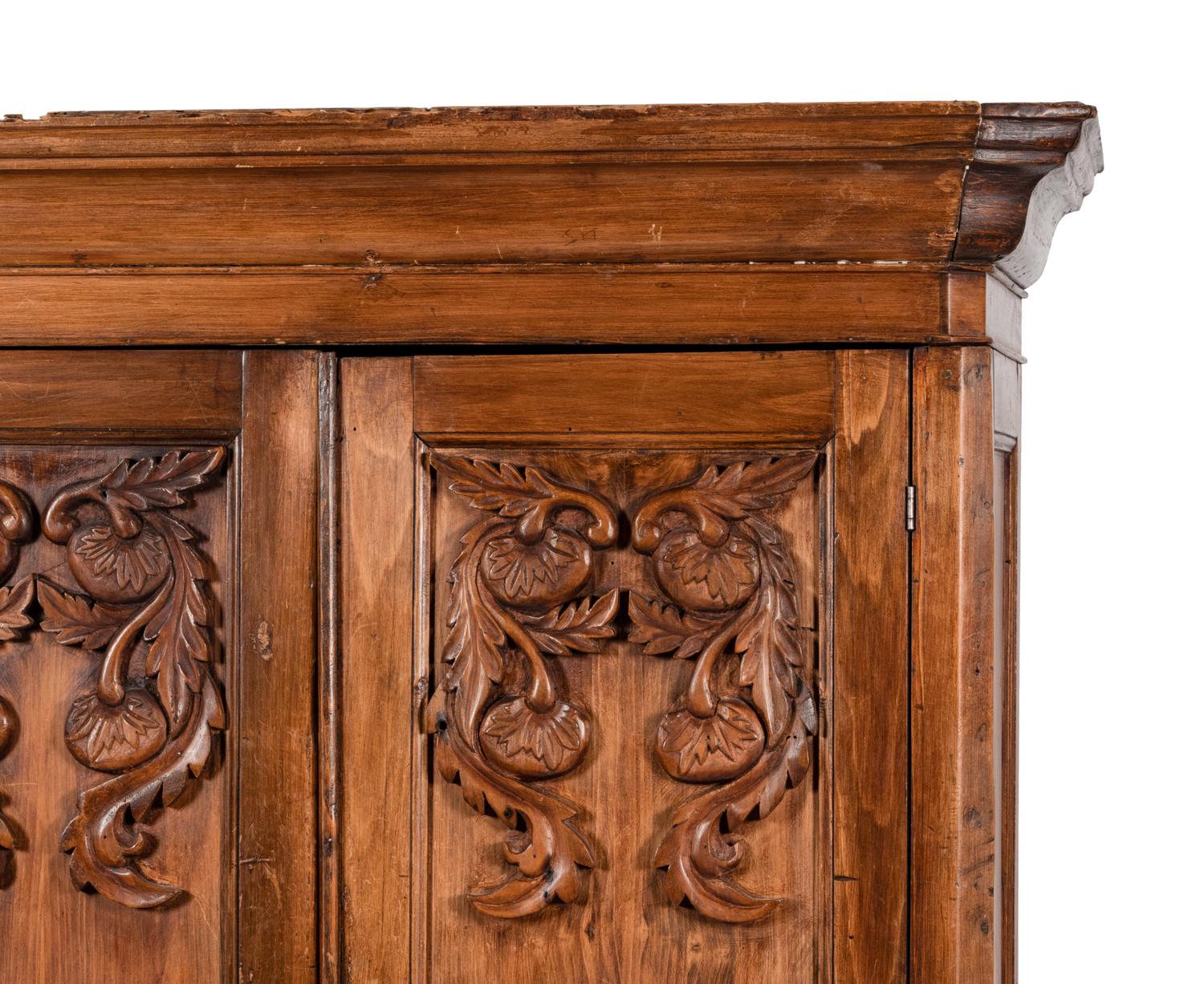 A Mexican Carved Walnut Wardrobe Cabinet