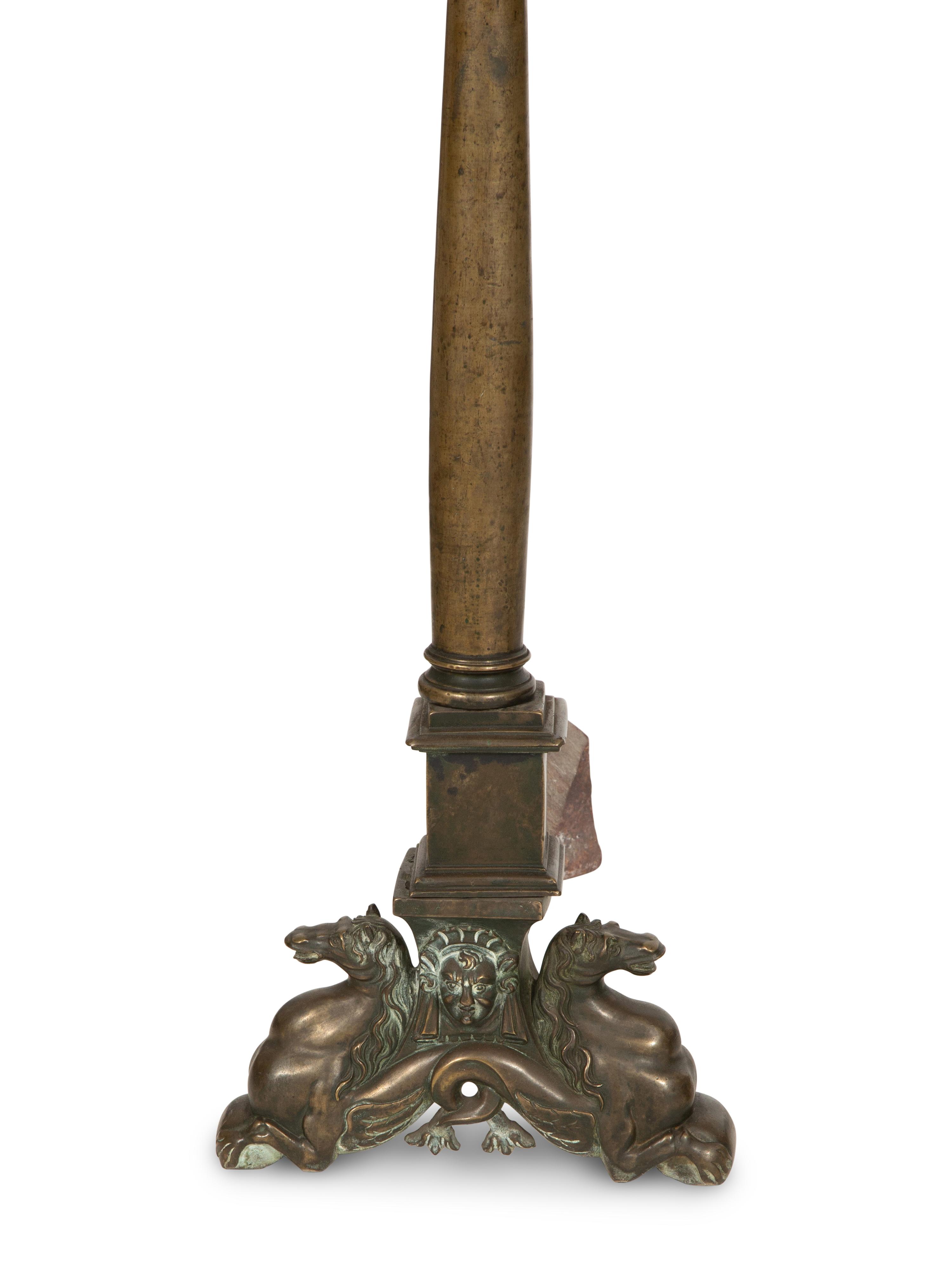 A Pair of Large Patinated Metal Andirons