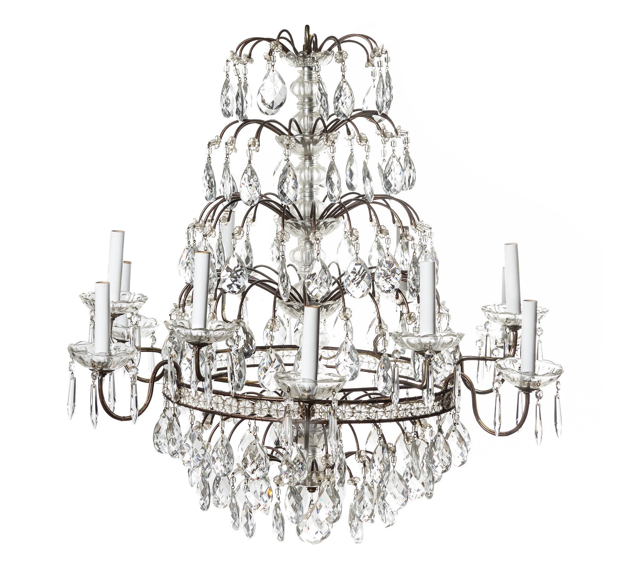 A French Cut Glass Twelve-Light Chandelier, Height 29 1/2 x diameter 31 inches.