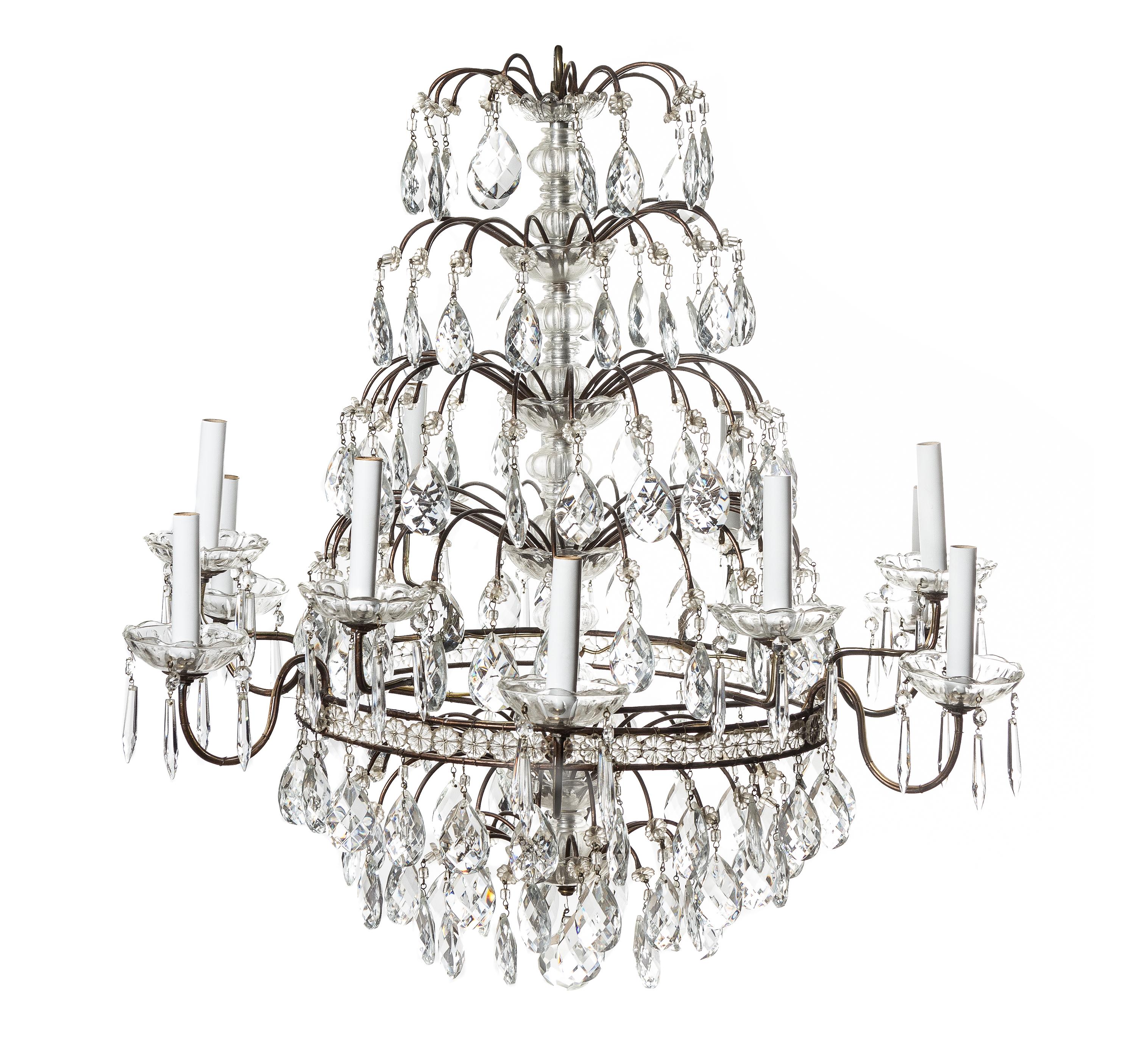 A French Cut Glass Twelve-Light Chandelier, Height 29 1/2 x diameter 31 inches.