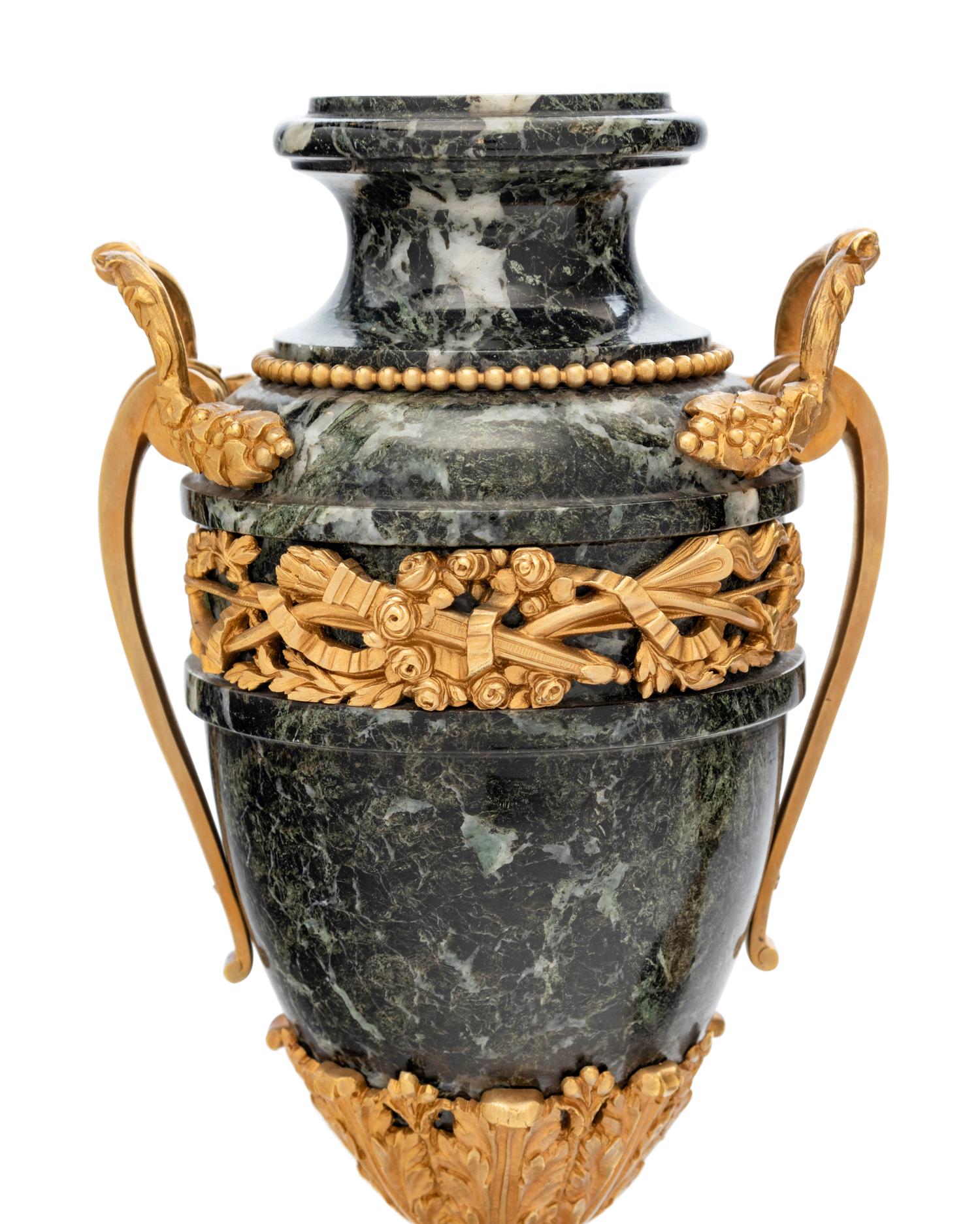 A Pair of Neoclassical Gilt Bronze Mounted Marble Urns
