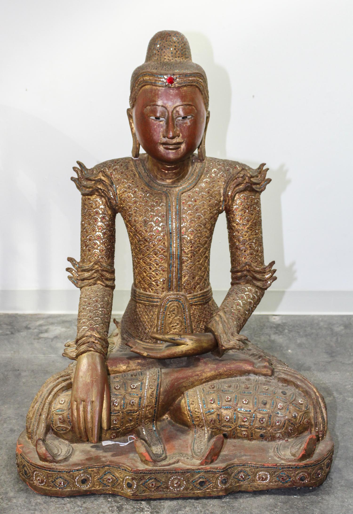 A Burmese Giltwood Seated Figure of Buddha Height 40 inches.