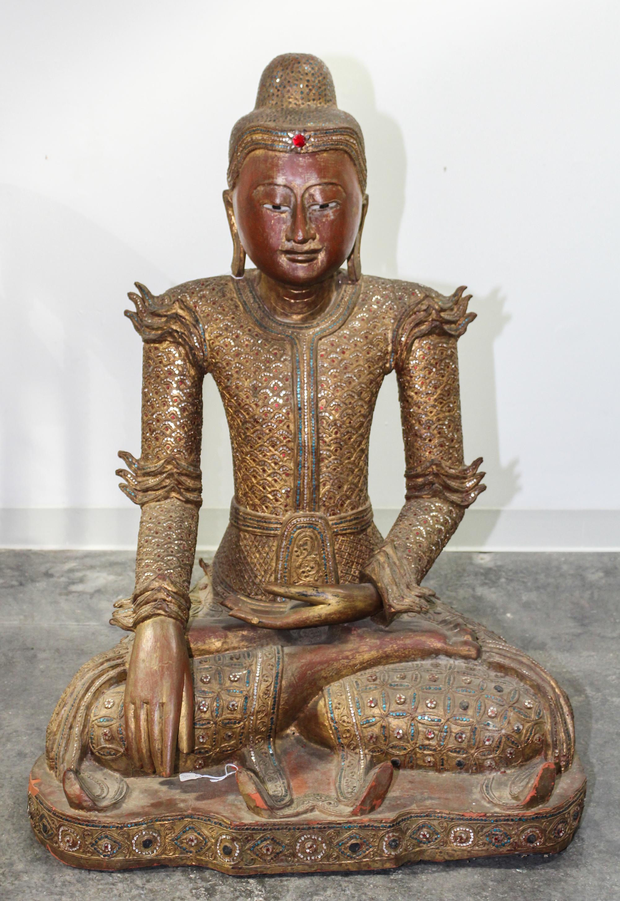 A Burmese Giltwood Seated Figure of Buddha Height 40 inches.