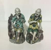 A Pair of Chinese Porcelain Figures. Height 8 inches.