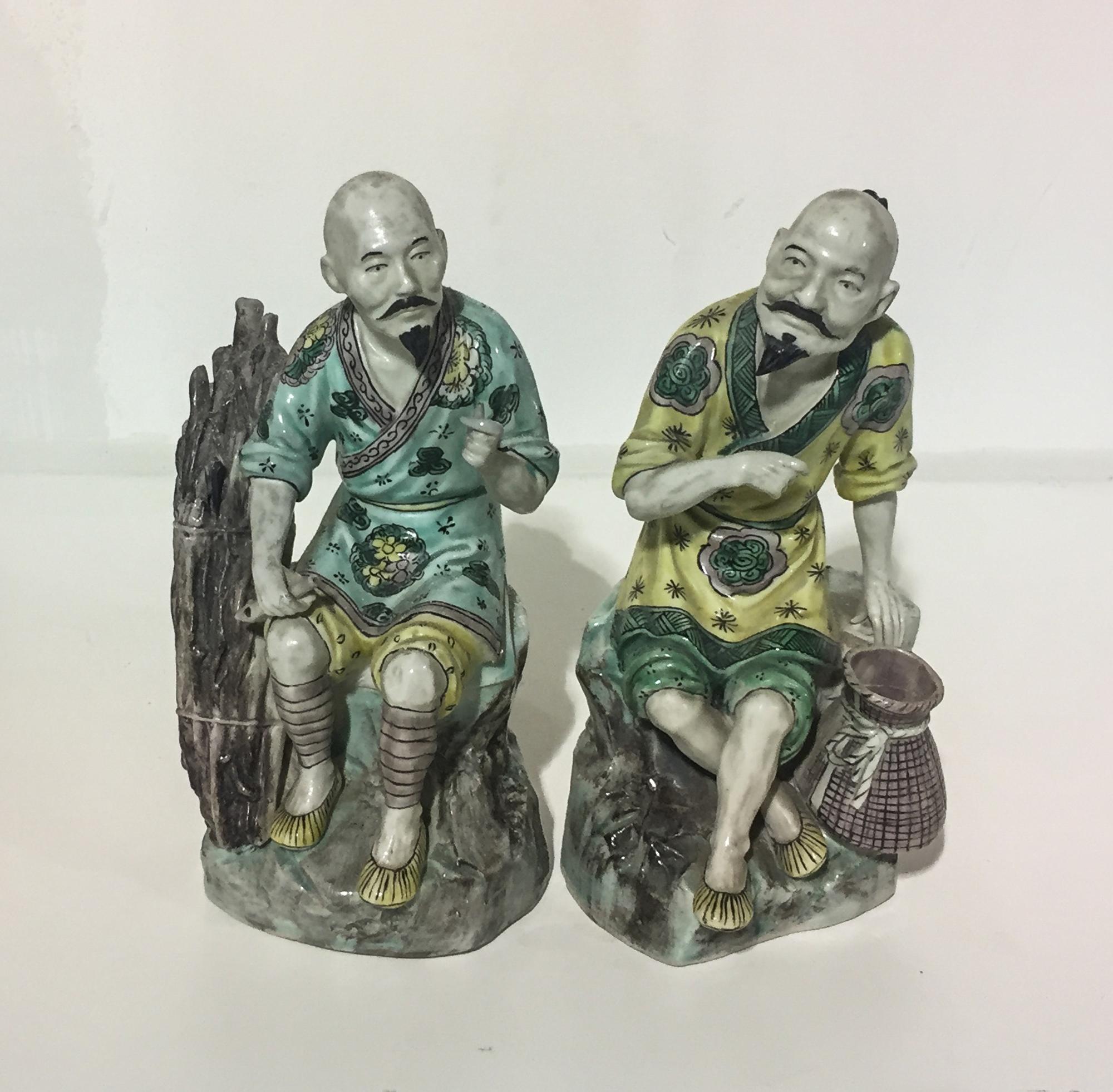 A Pair of Chinese Porcelain Figures. Height 8 inches.