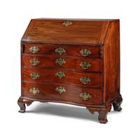 A Chippendale Figured and Fan-Carved Mahogany Serpentine Slant-Front Desk