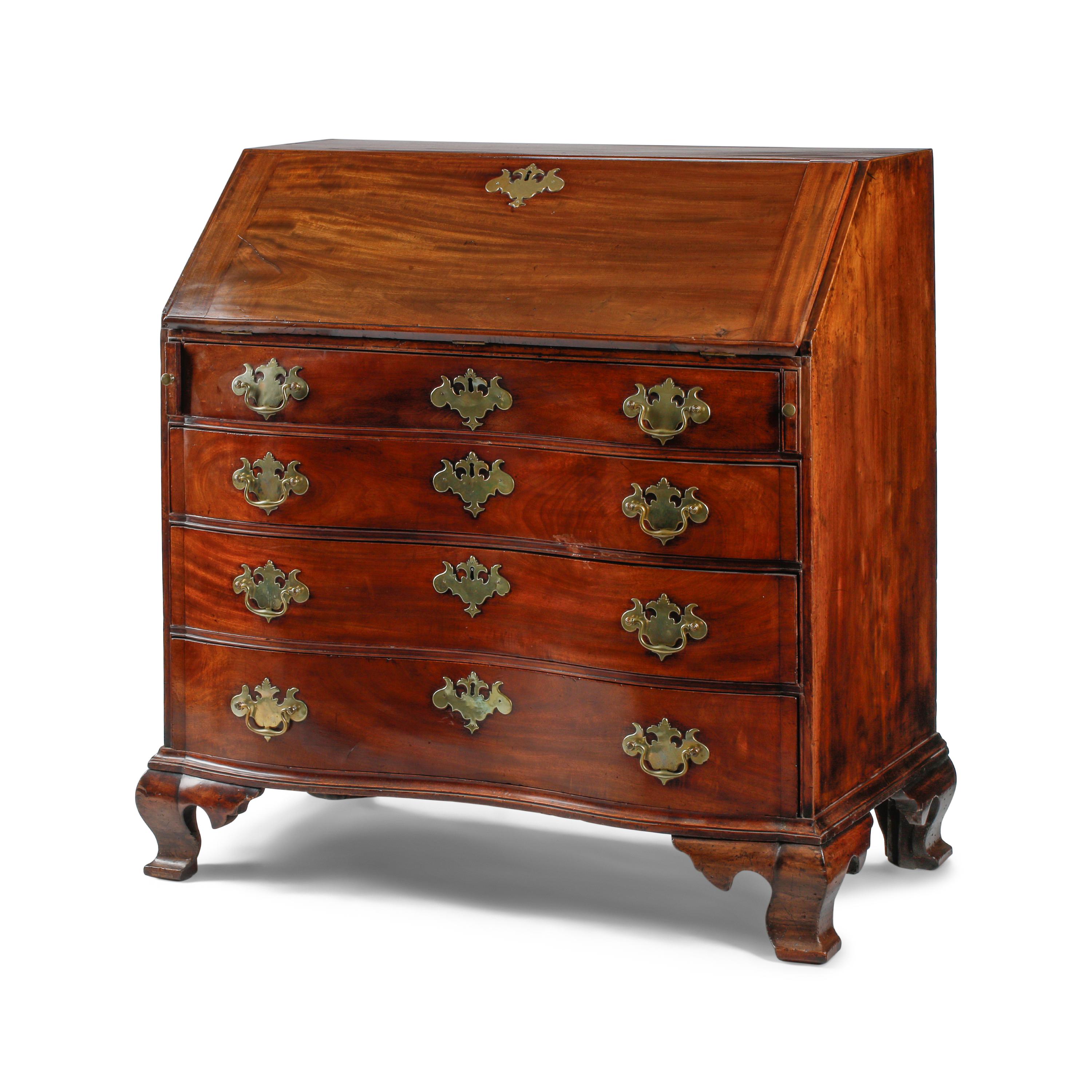A Chippendale Figured and Fan-Carved Mahogany Serpentine Slant-Front Desk