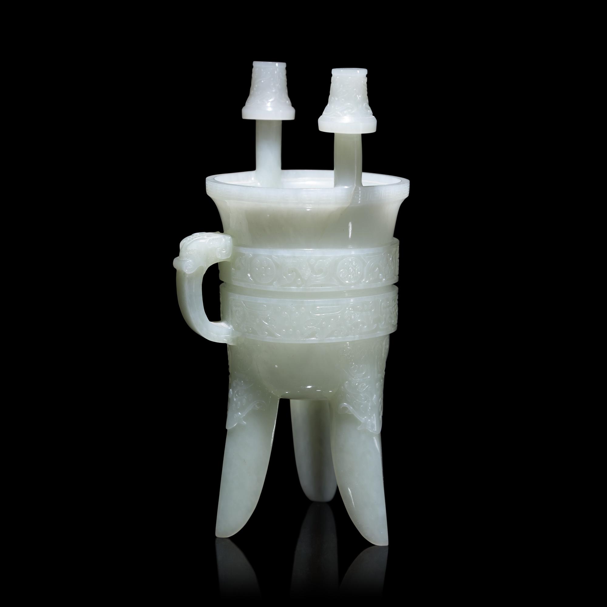 A Chinese Carved Pale Celadon Jade Tripod Vessel, Jia, Late Qing - Early Republic Period 晚清/民國 青白玉仿古斝