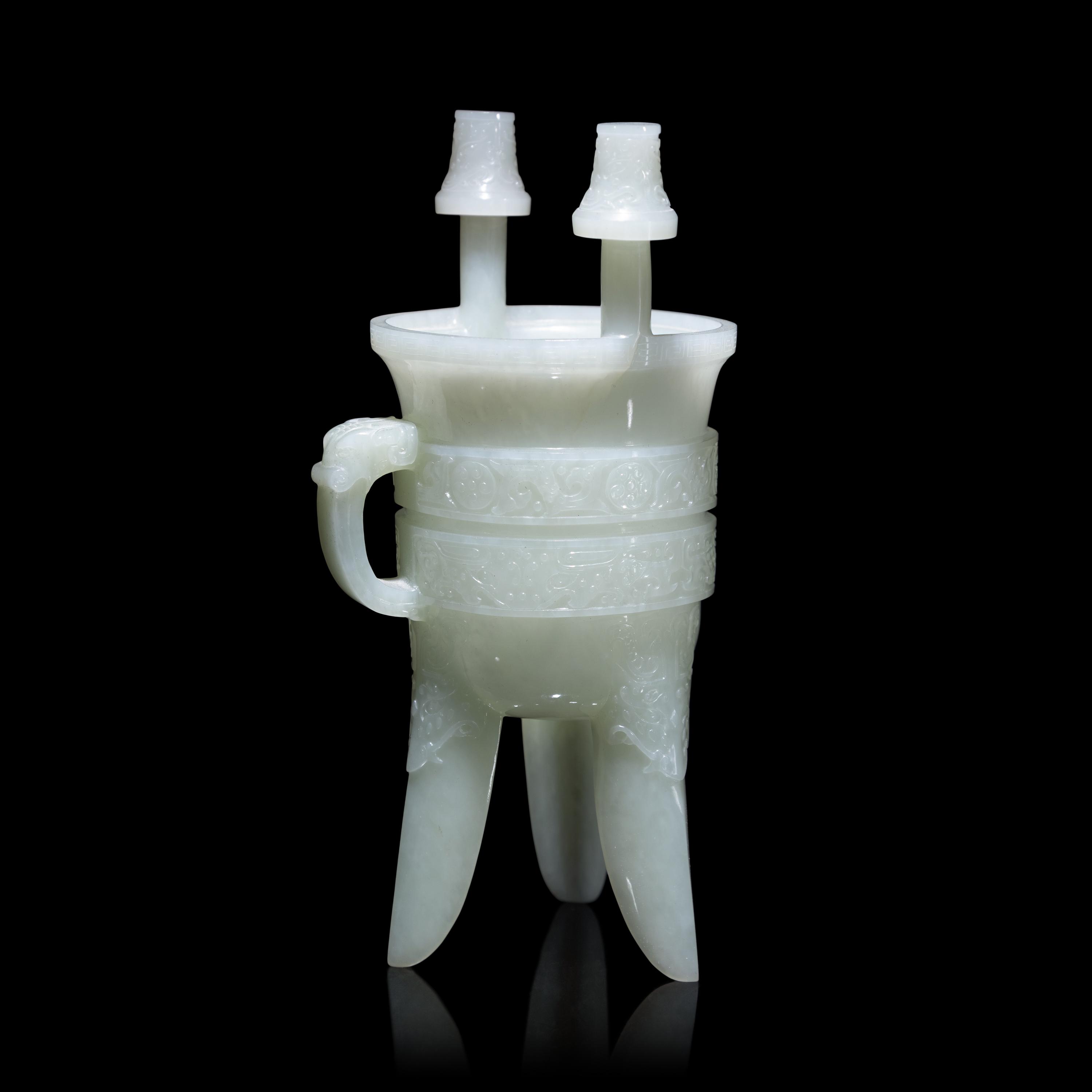A Chinese Carved Pale Celadon Jade Tripod Vessel, Jia, Late Qing - Early Republic Period 晚清/民國 青白玉仿古斝
