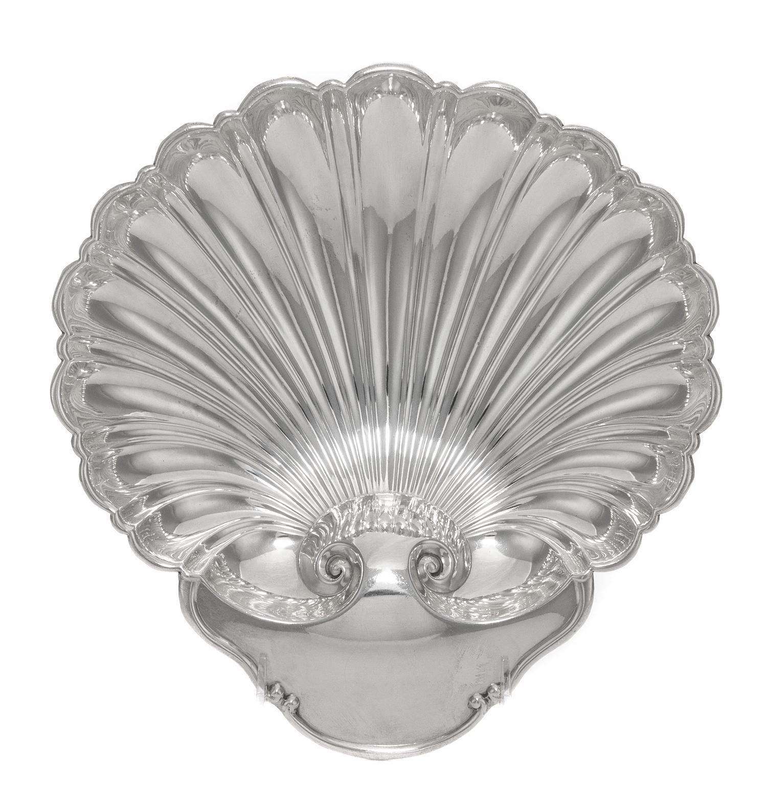 An American Silver Shell Form Dish, Tuttle Silversmiths, Boston, MA, 20th Century, raised on three ball feet.