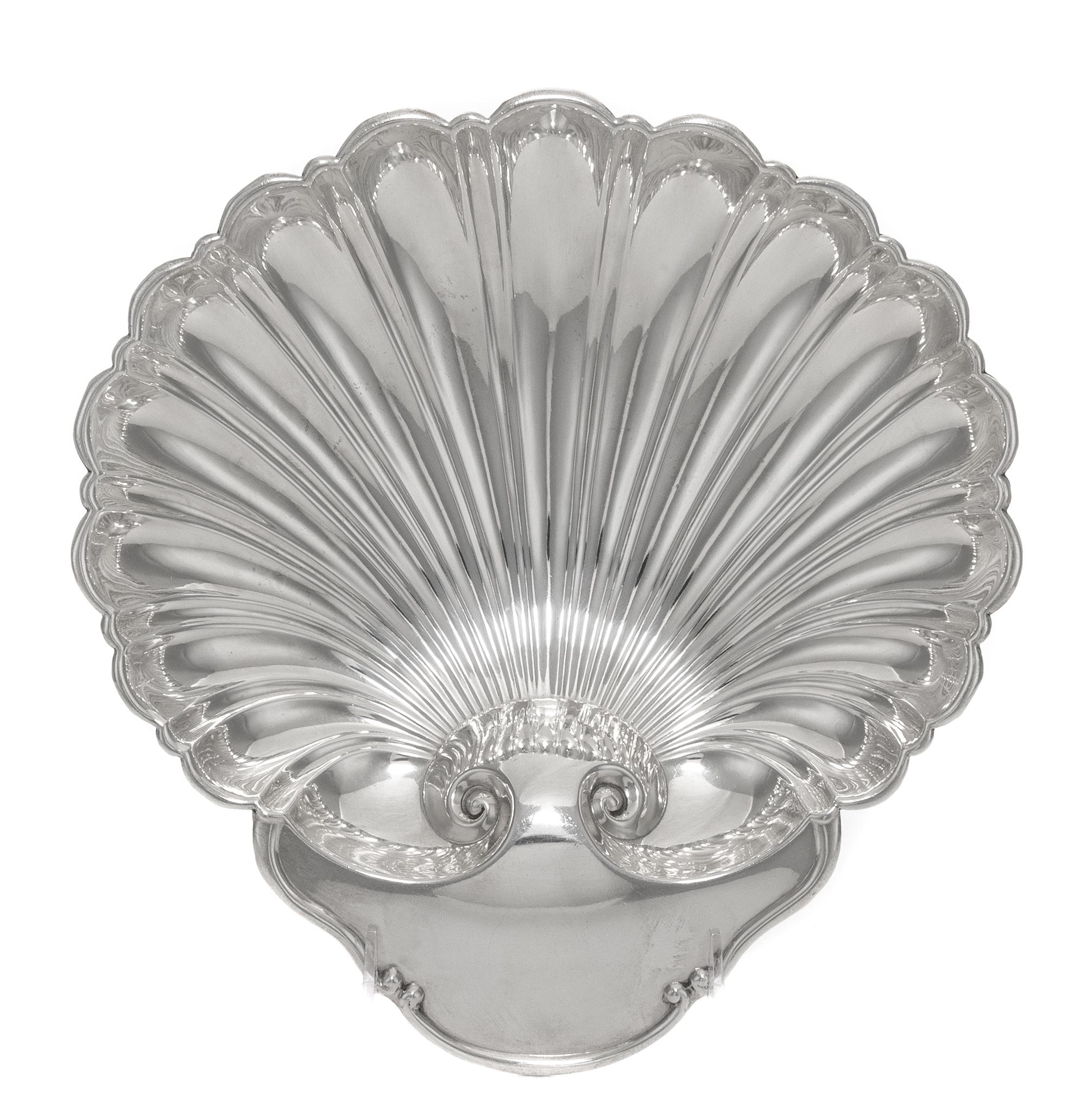 An American Silver Shell Form Dish, Tuttle Silversmiths, Boston, MA, 20th Century, raised on three ball feet.
