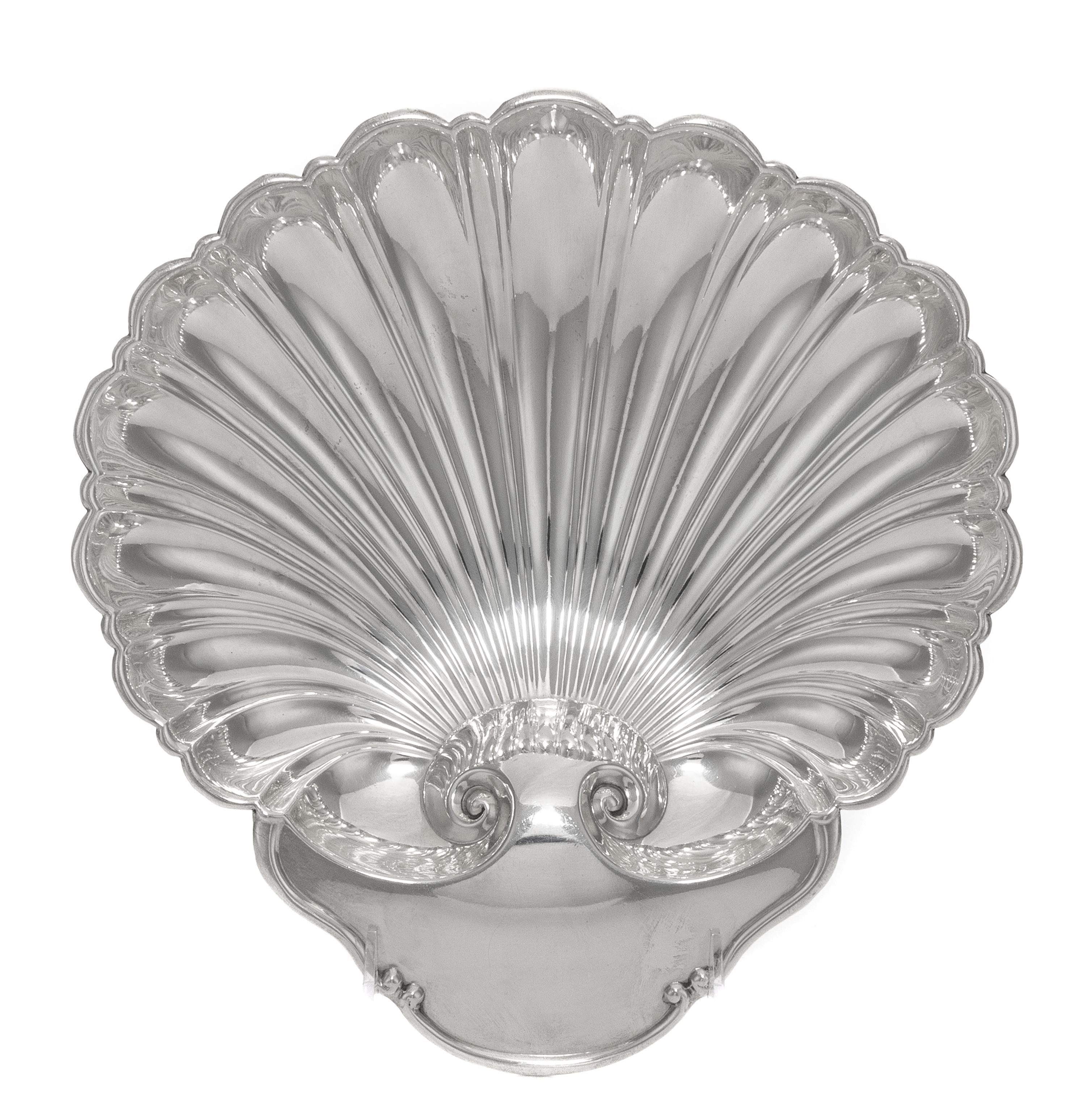 An American Silver Shell Form Dish, Tuttle Silversmiths, Boston, MA, 20th Century, raised on three ball feet.