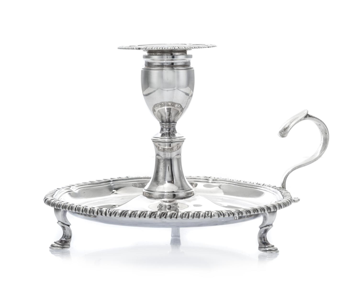 A George III Silver Chamberstick, Robert Gerrard I, London, 1808, of typical form with a gadrooned rim, raised on S-scroll feet.
