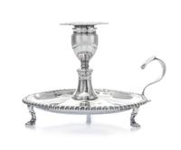 A George III Silver Chamberstick, Robert Gerrard I, London, 1808, of typical form with a gadrooned rim, raised on S-scroll feet.