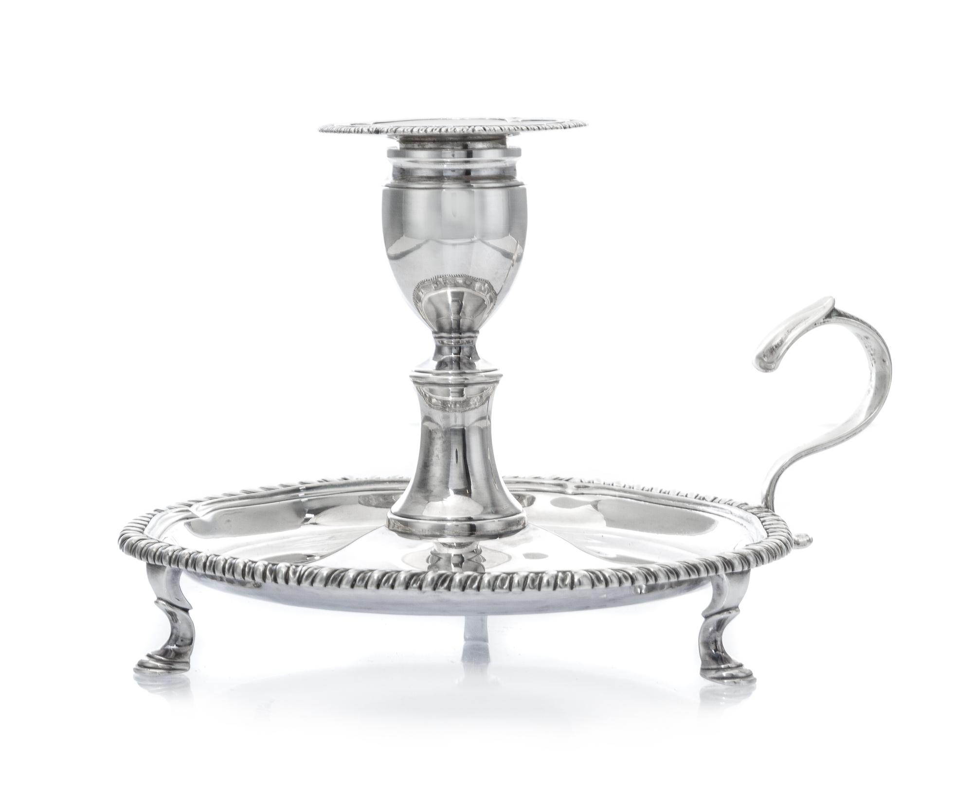 A George III Silver Chamberstick, Robert Gerrard I, London, 1808, of typical form with a gadrooned rim, raised on S-scroll feet.