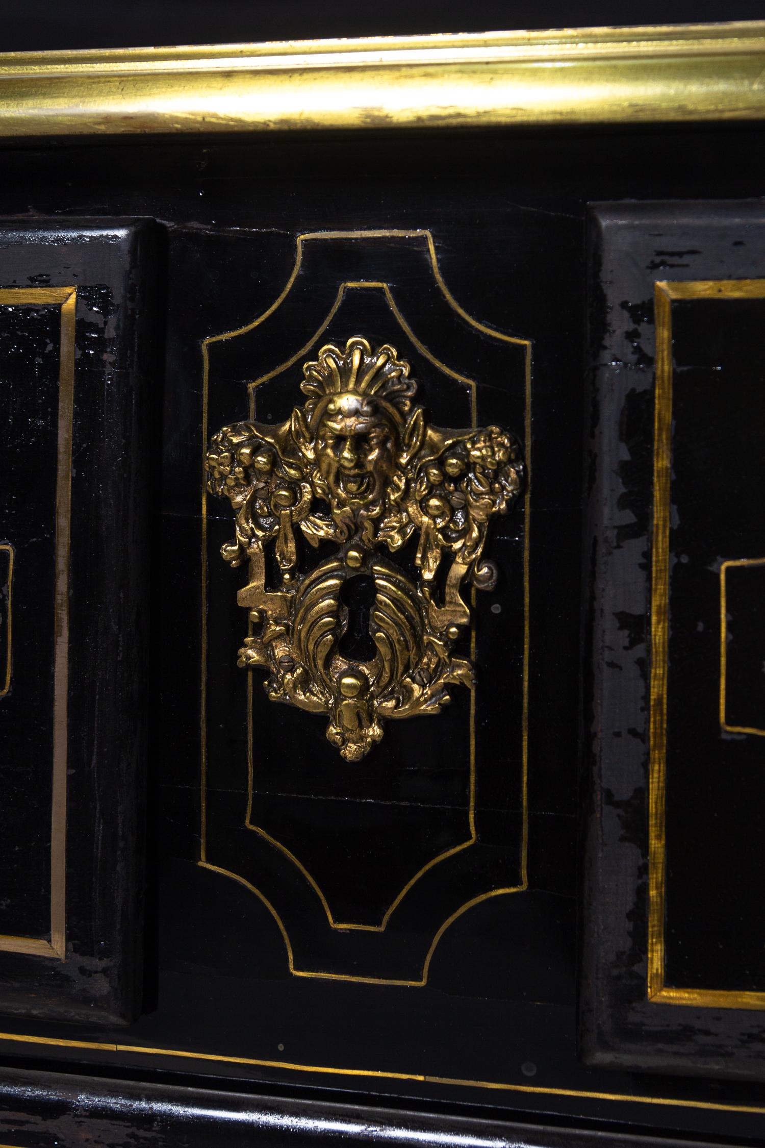 A Régence Gilt Bronze Mounted Ebony Commode