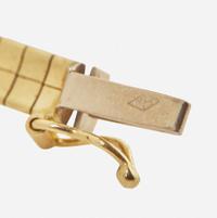 A 14K Yellow Gold Omega Chain and Slider Charms