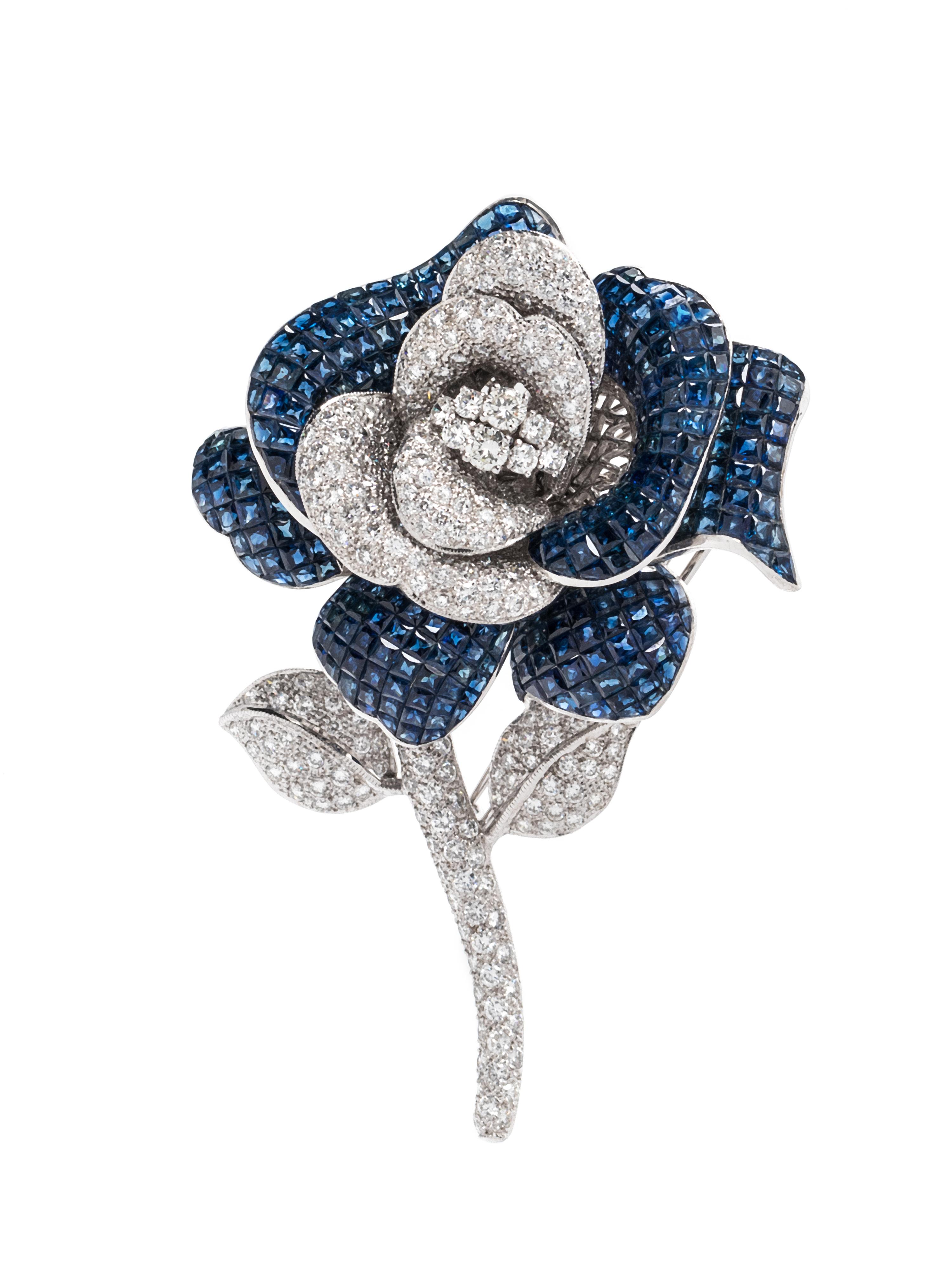 INVISIBLY-SET SAPPHIRE AND DIAMOND FLOWER BROOCH