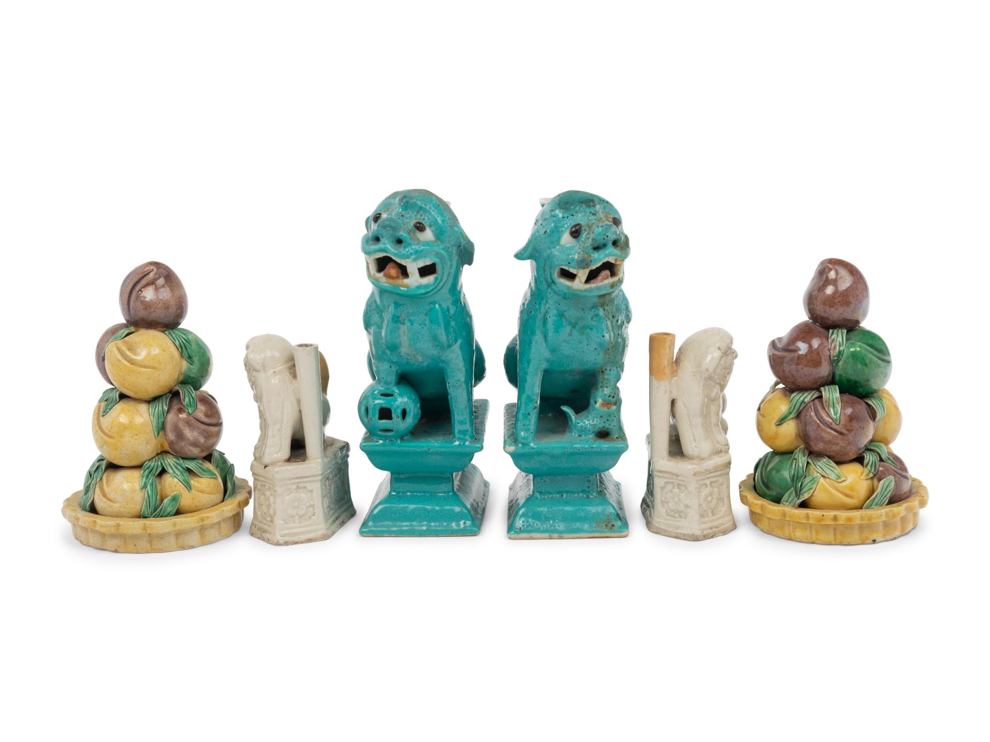 Two Pairs of Chinese Monochrome Glazed Porcelain Figures of Fu Lions and a Pair of Sancai Glazed Porcelain Models of Fruit